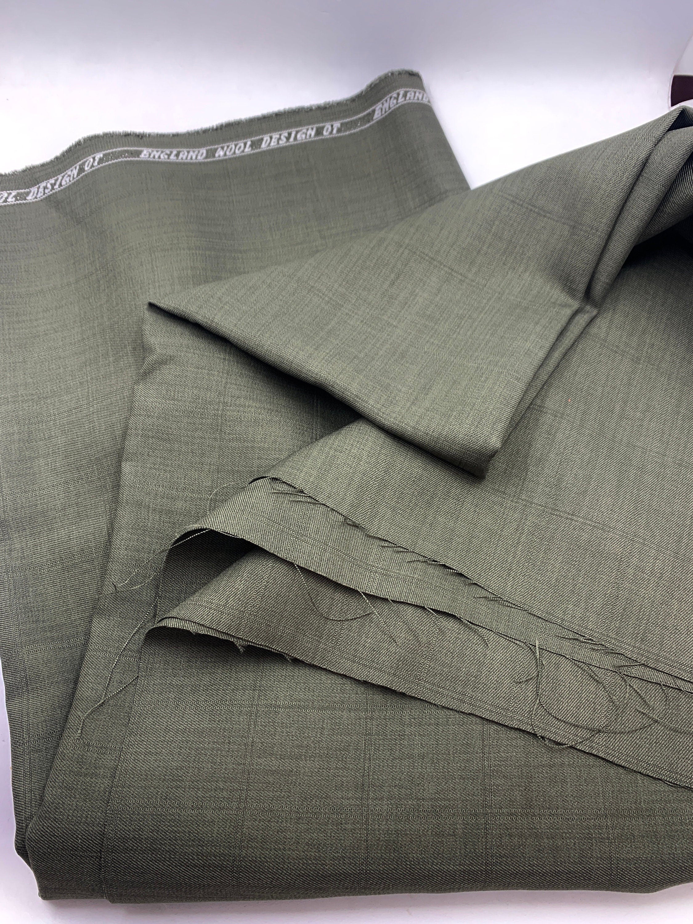 Suiting fabric. Color Sage design 18549E 100% polyester width 58/60 inches. shop with confidence ask for free sample available.