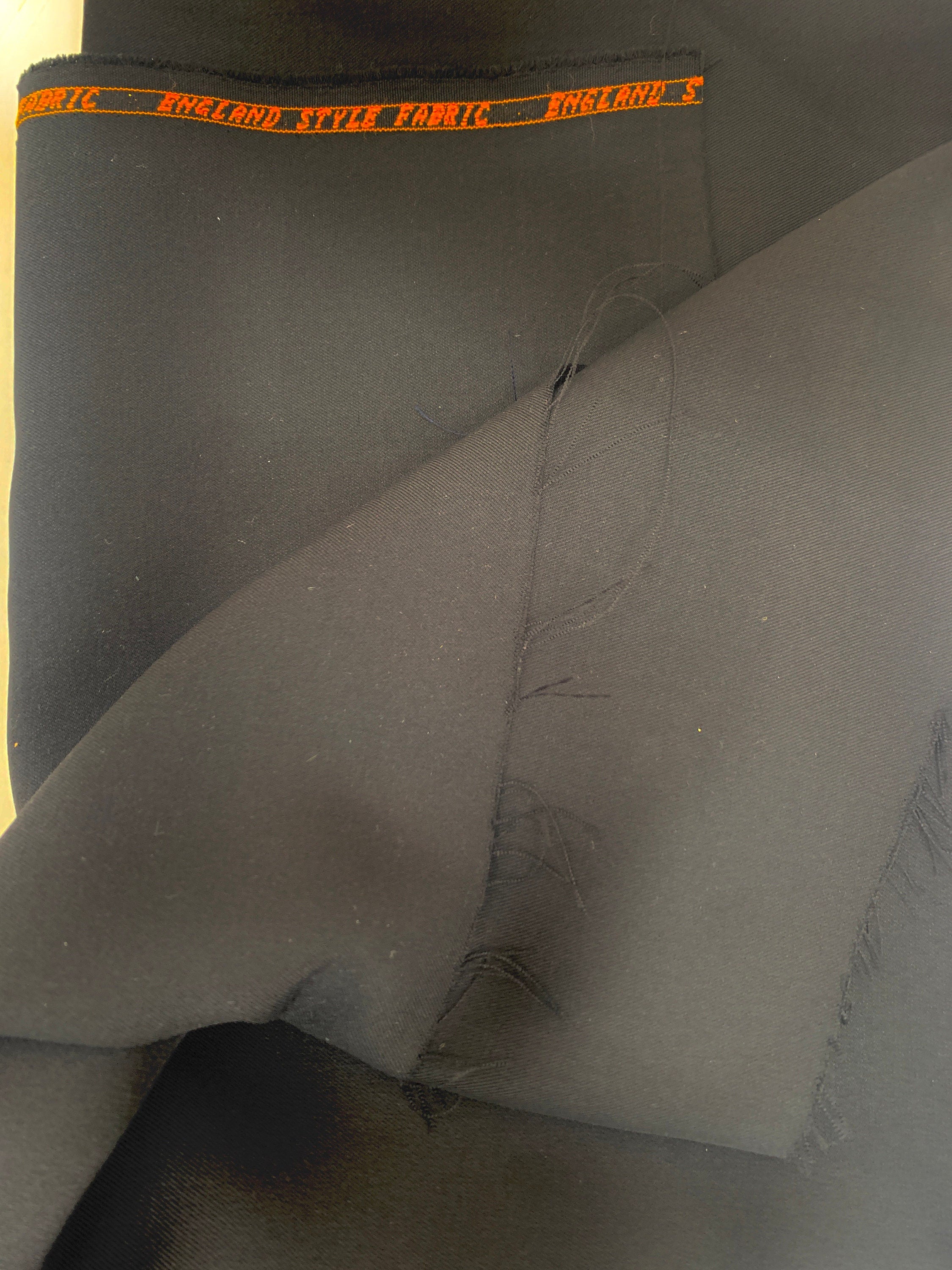 Suiting Fabric color true Black 100% polyester. Free sample available.