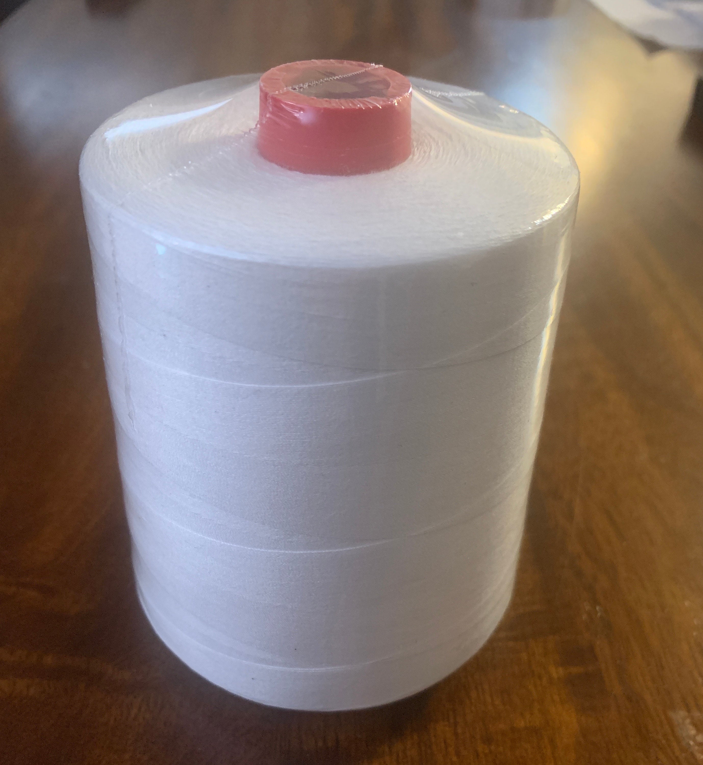 Cotton thread, Sewing Thread White cotton mercerized spool length of 9000 to 10000 yards and weighing 280 grams size 35s/2. color white.
