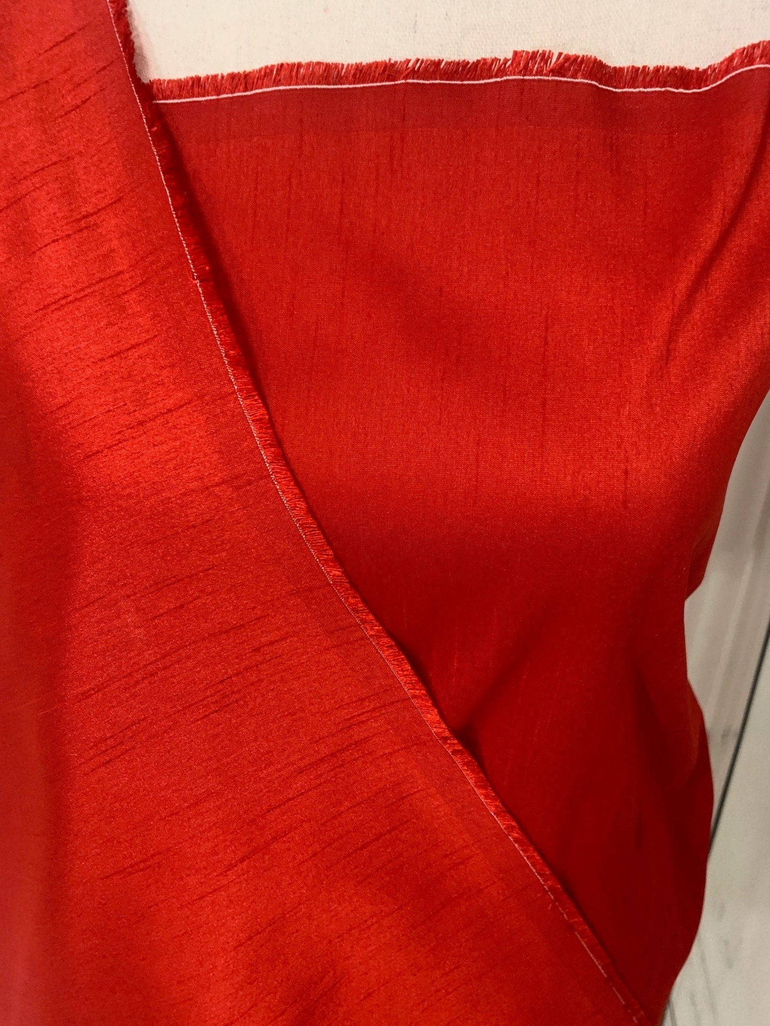 Red satin shantung fabric width 58" polyester, slubbed texture dull fininshed, dress, suiting and home decoration item. item 114