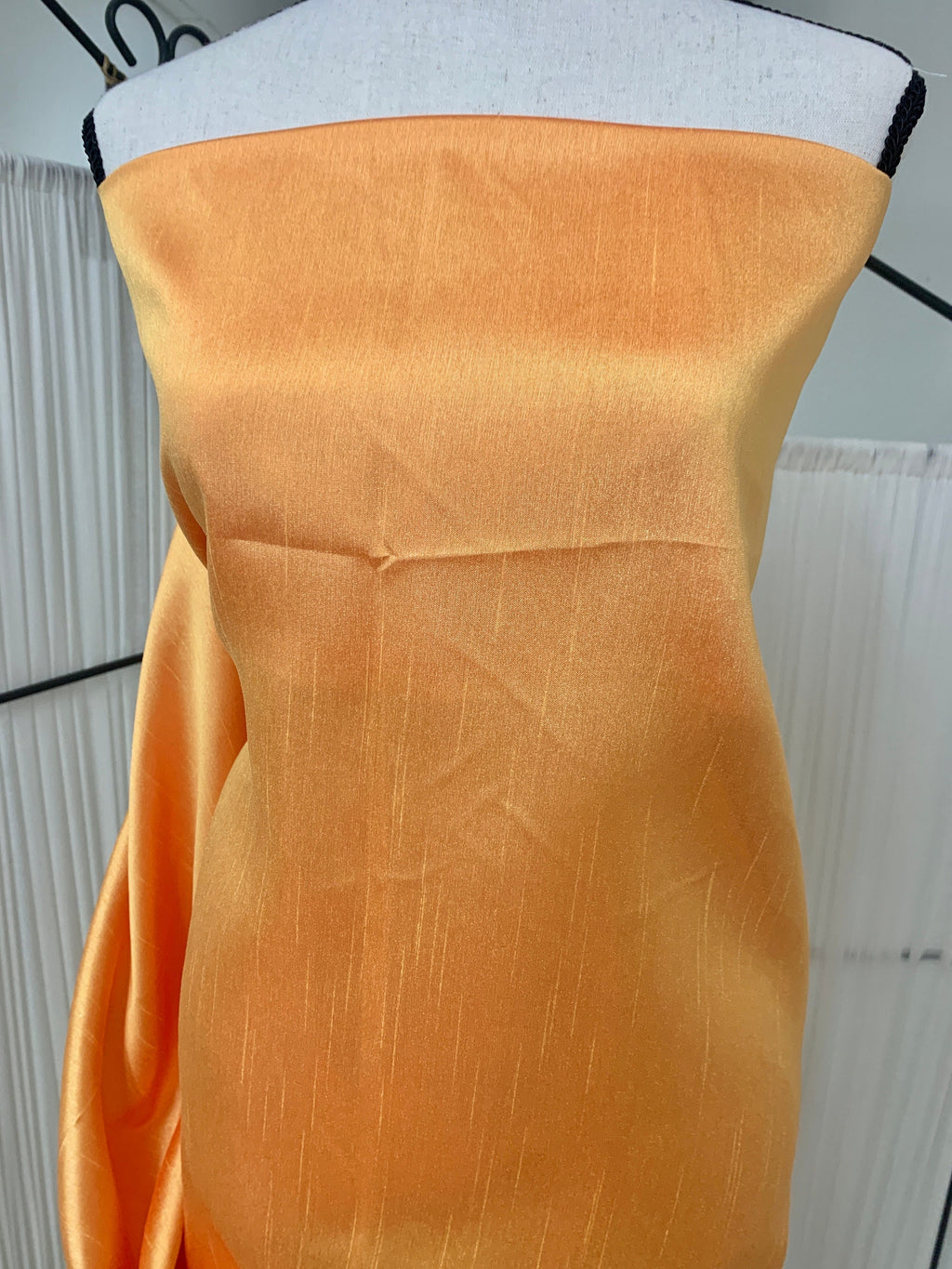 Gold Shimmer fabric two tone threads in yellow and orange, creating an orange sheen. Requires dry cleaning for maintenance. Free sample.