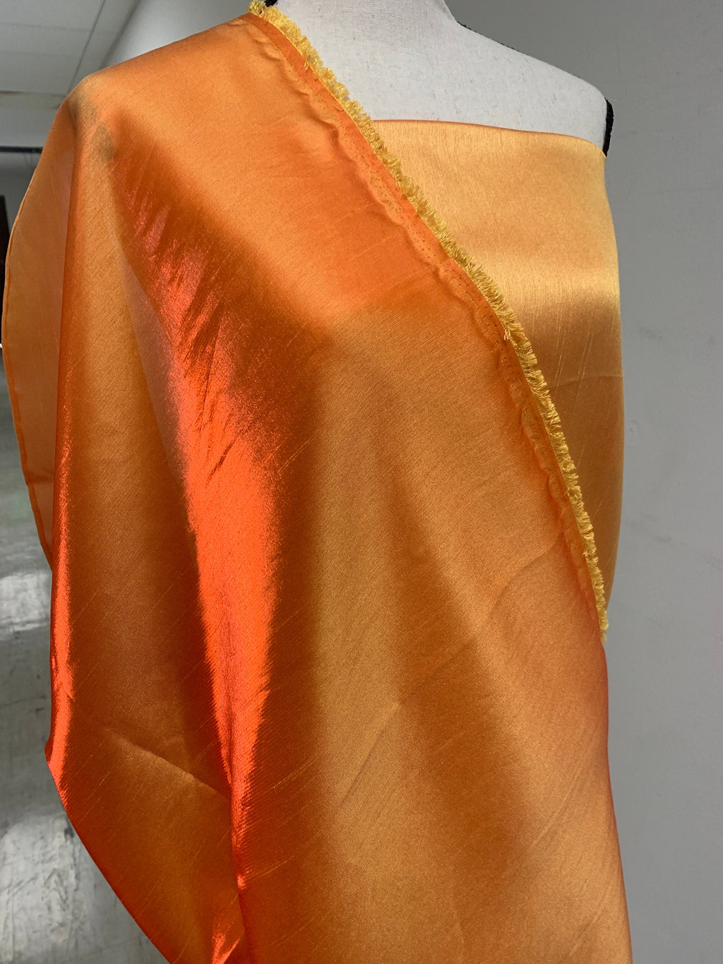 Gold Shimmer fabric two tone threads in yellow and orange, creating an orange sheen. Requires dry cleaning for maintenance. Free sample.