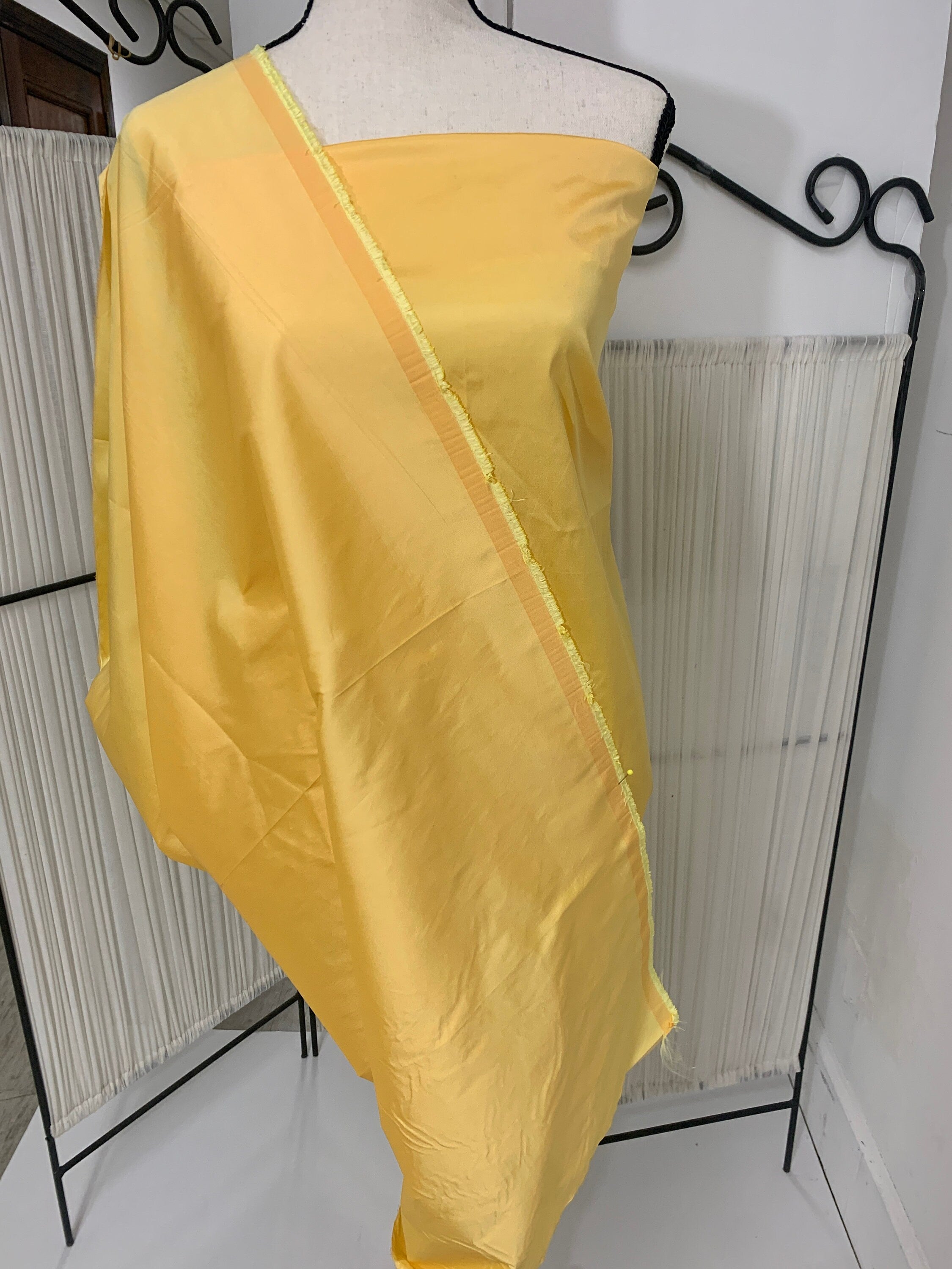 Yellow Taffeta Two tone fabric width 58" polyester actual color is yellow with gold tone great for party dress.