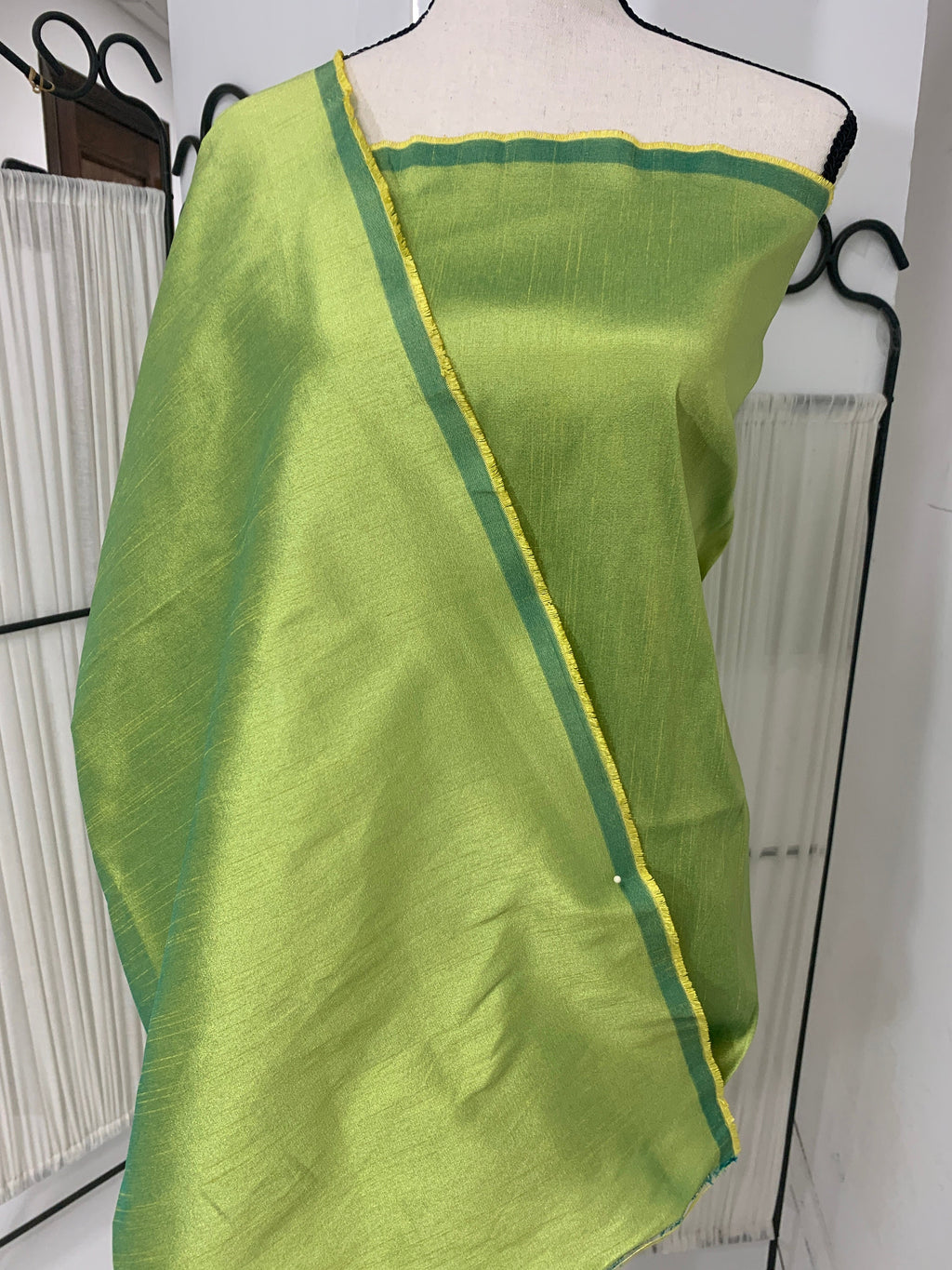 Olive poly dupioni fabric width 58". fabric has fuchsia tone, made of two different color of olive and turquoise blue. free smple.