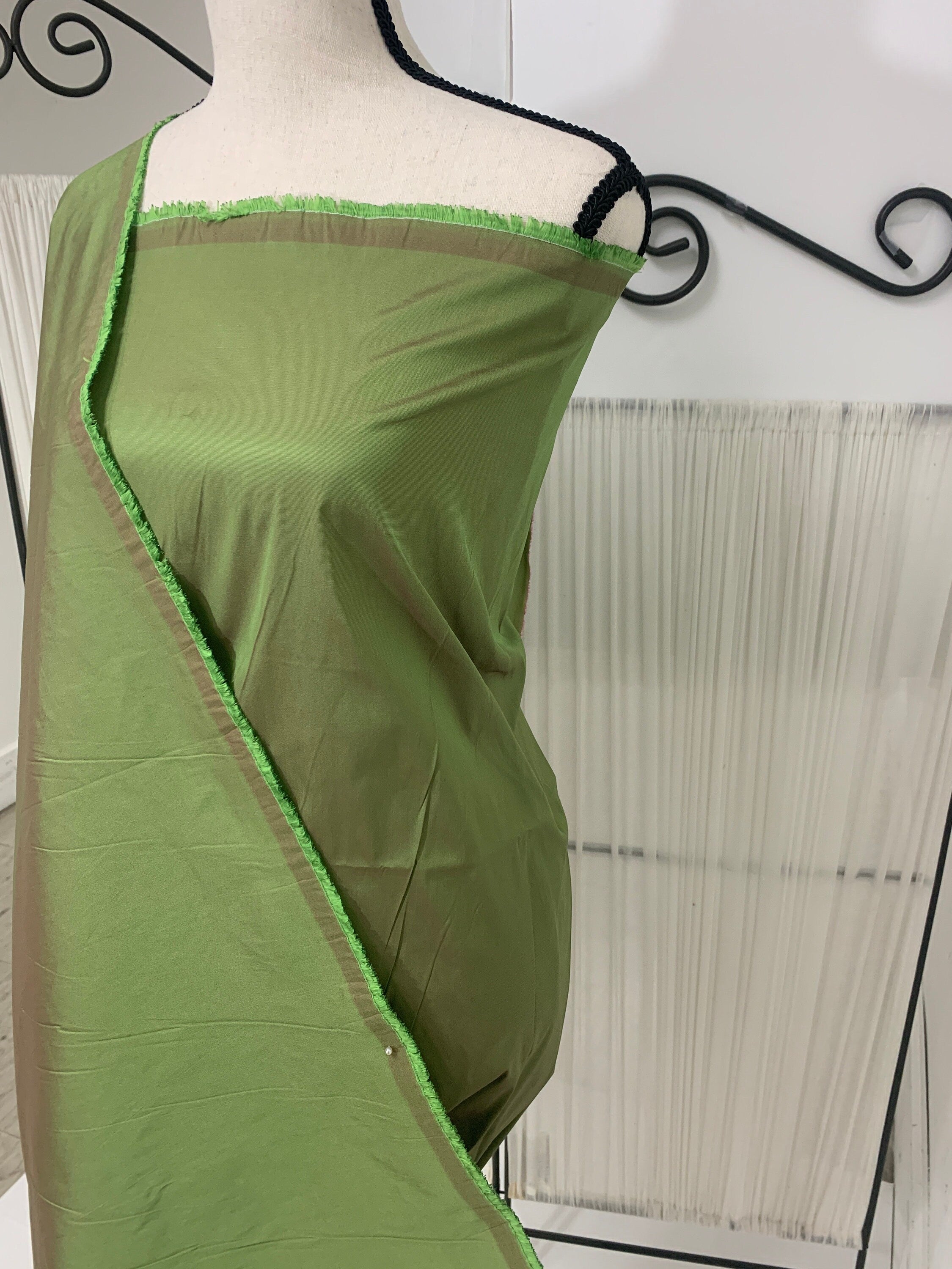 A 2 yards cut Olive Taffeta fabric . Two tone fabric width 58" polyester fabric has a tone of Fuchsia shading. FREE sample. item 115
