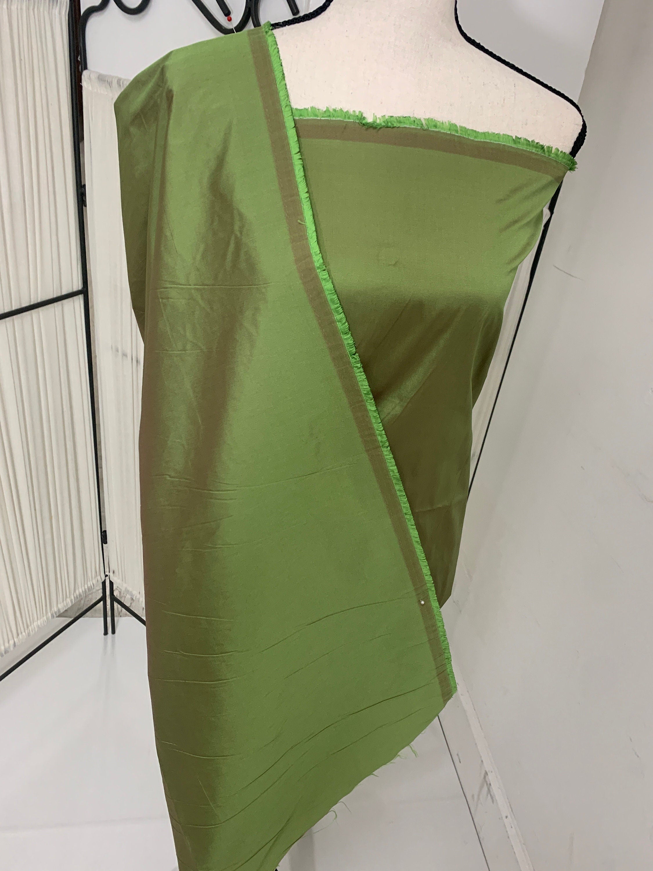 A 2 yards cut Olive Taffeta fabric . Two tone fabric width 58" polyester fabric has a tone of Fuchsia shading. FREE sample. item 115