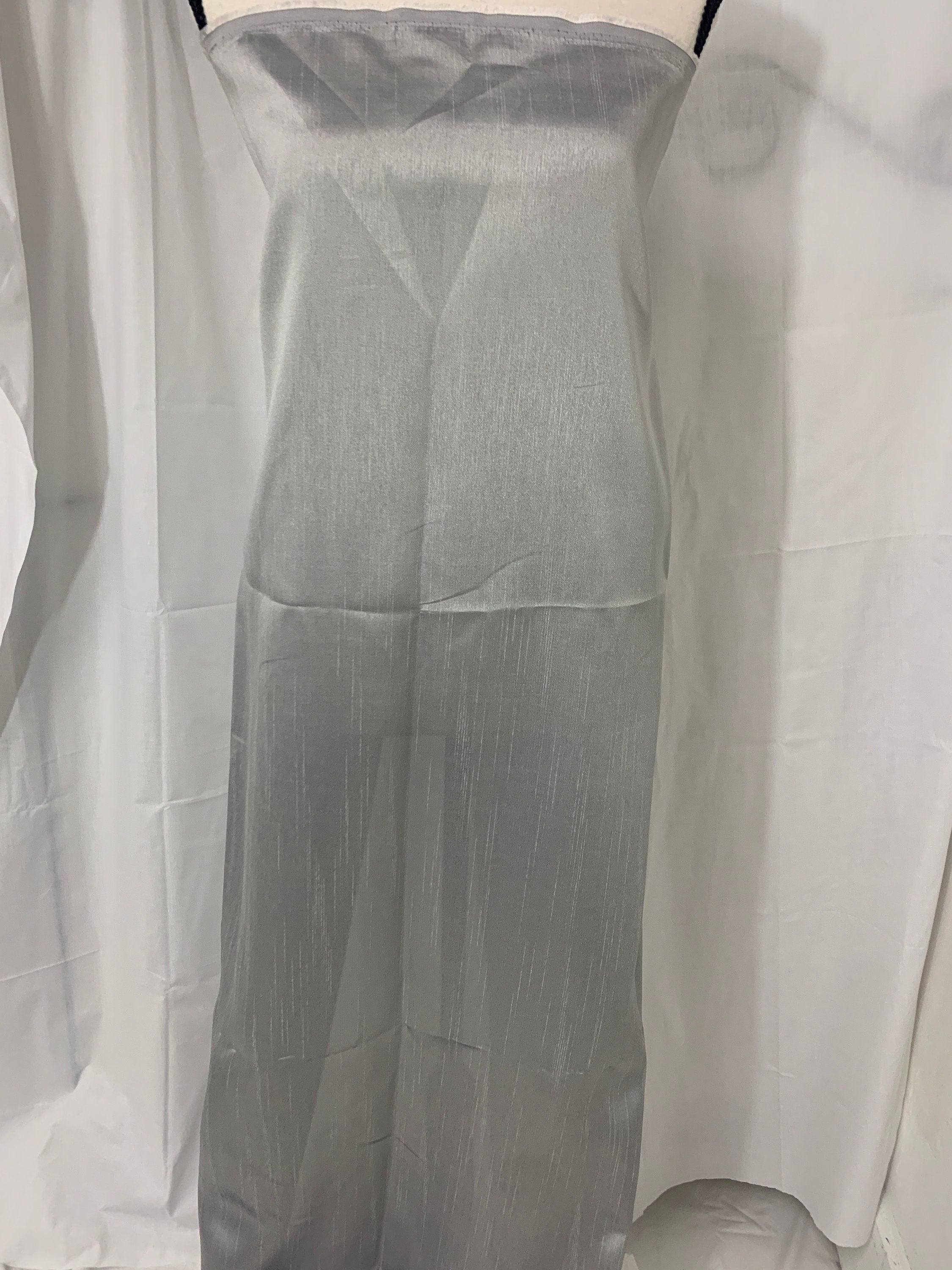 silver grey shimmer shantung fabric, width 58". Is a double sided fabric with slub, shimmery and dull sides dry clean fabric. Free sample.