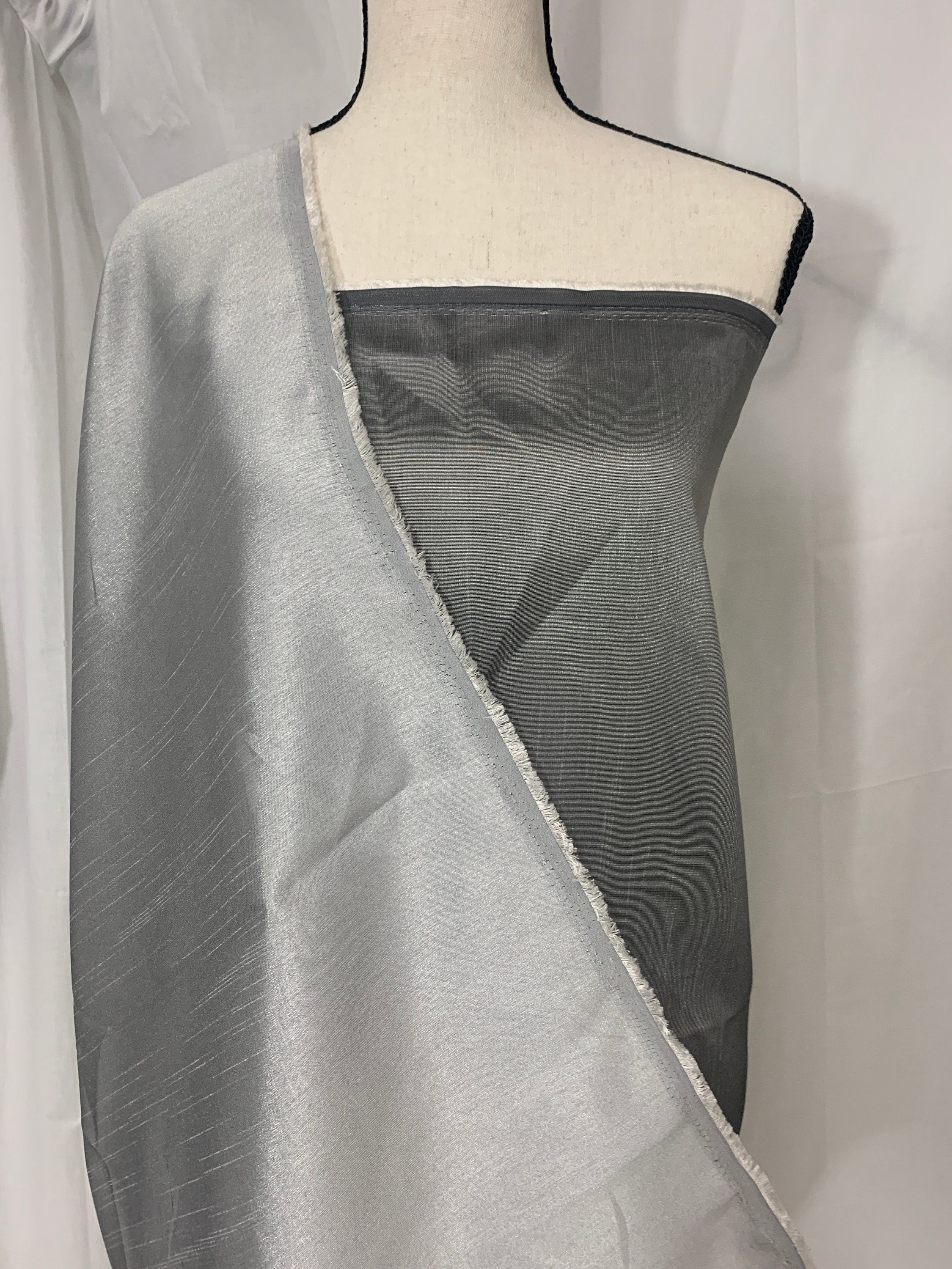 silver grey shimmer shantung fabric, width 58". Is a double sided fabric with slub, shimmery and dull sides dry clean fabric. Free sample.
