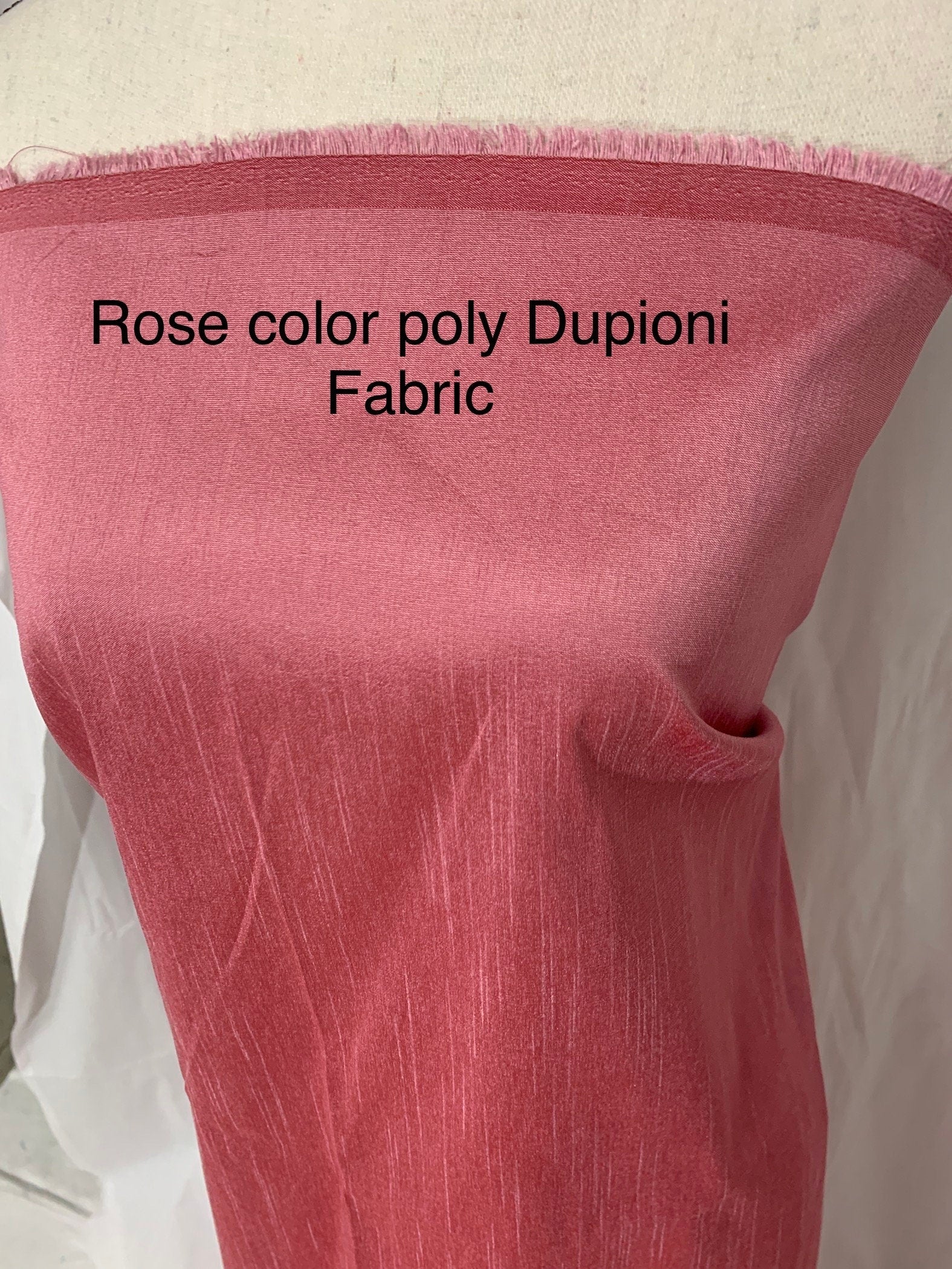 Rose color poly dupioni fabric width 58". made of two different color of threads sage and yellow. free smple. item# 108