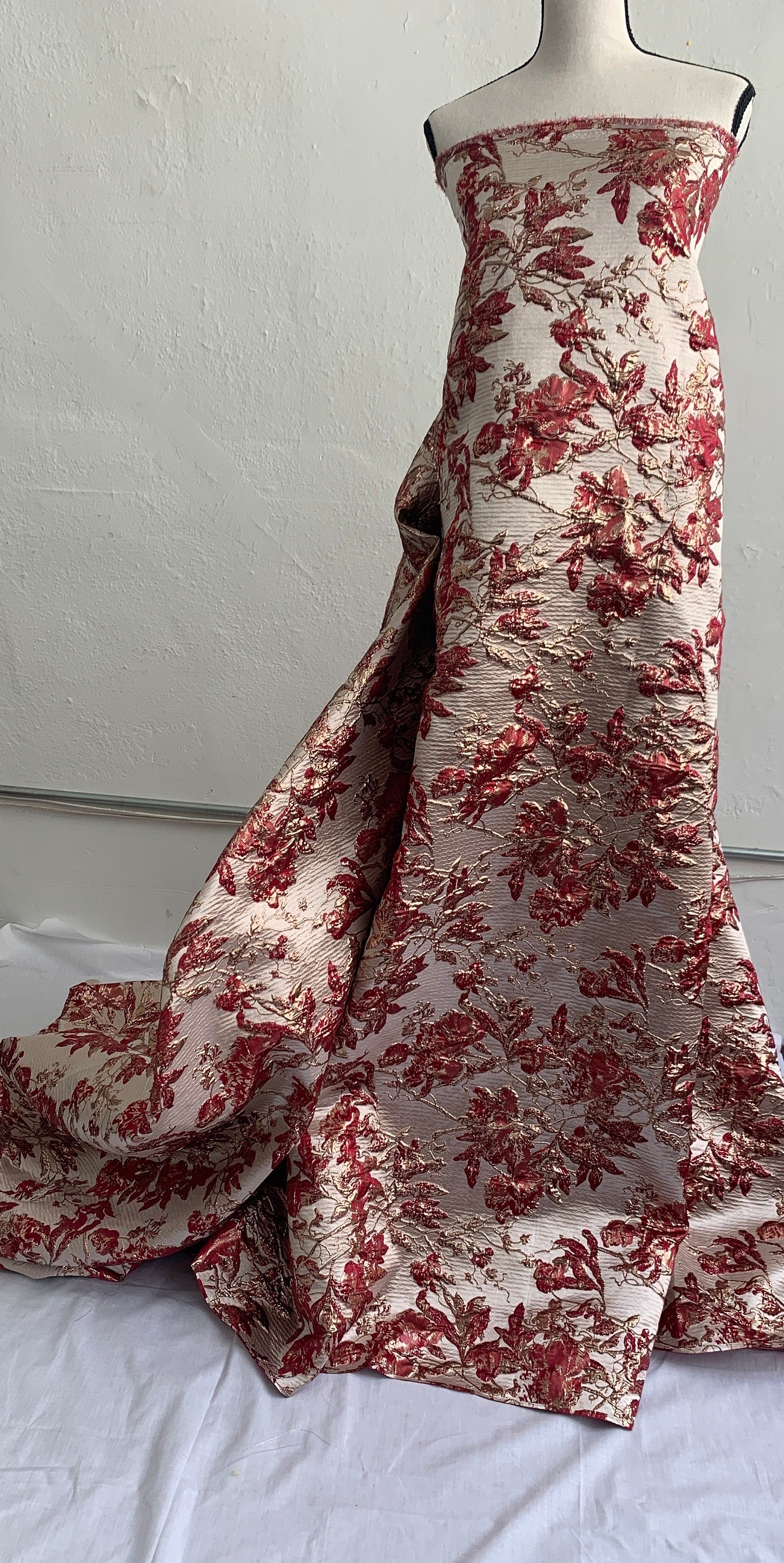 Brocade floral metallic fabric. color burgundy 56"