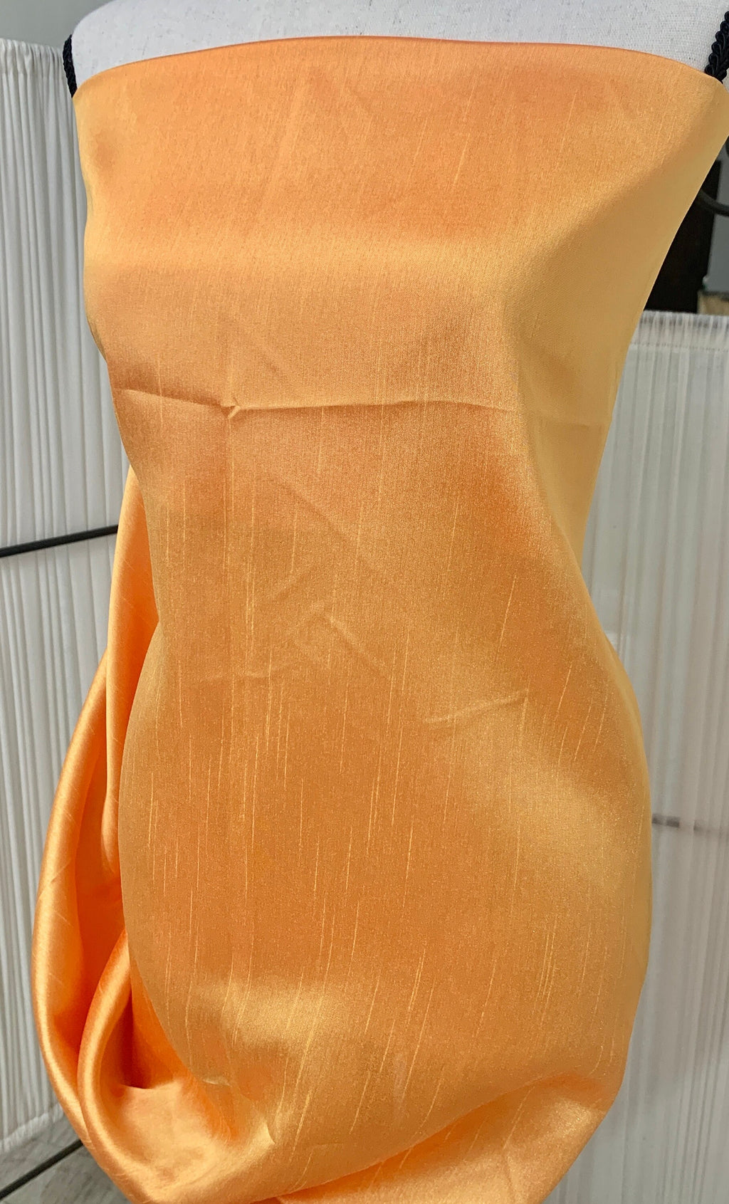 Gold Shimmer fabric two tone threads in yellow and orange, creating an orange sheen. Requires dry cleaning for maintenance. Free sample.