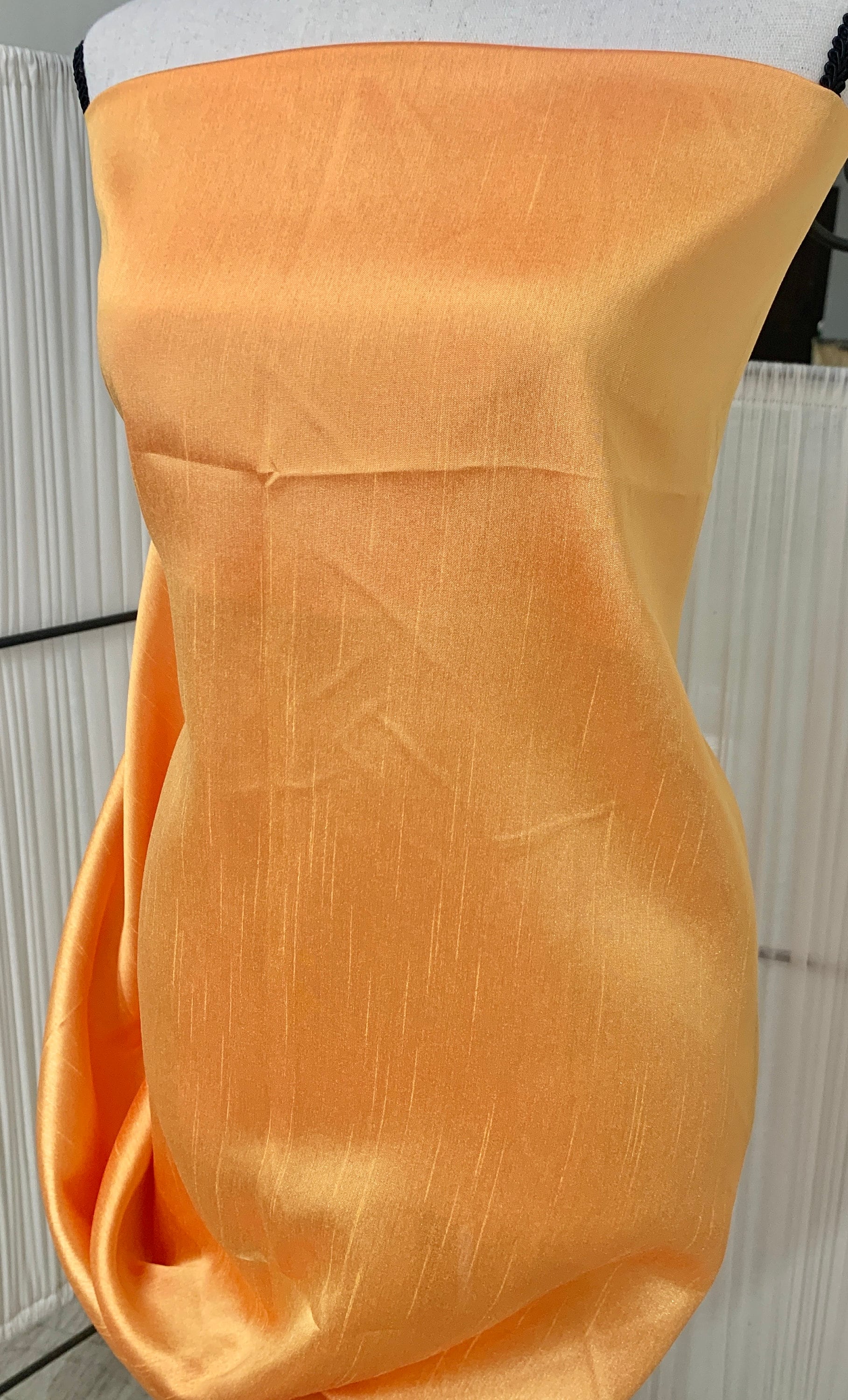 Gold Shimmer fabric two tone threads in yellow and orange, creating an orange sheen. Requires dry cleaning for maintenance. Free sample.