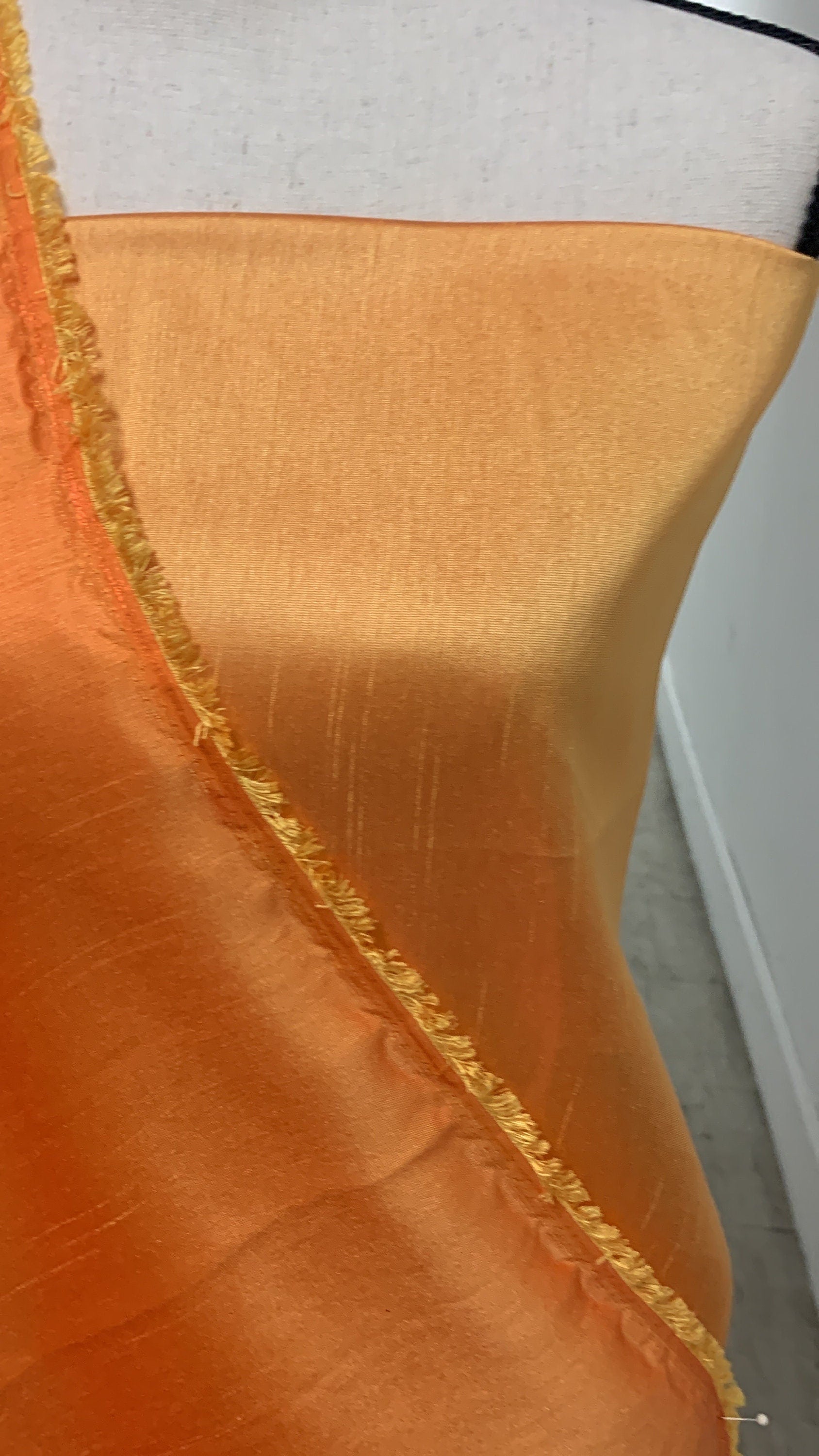 Gold Shimmer fabric two tone threads in yellow and orange, creating an orange sheen. Requires dry cleaning for maintenance. Free sample.