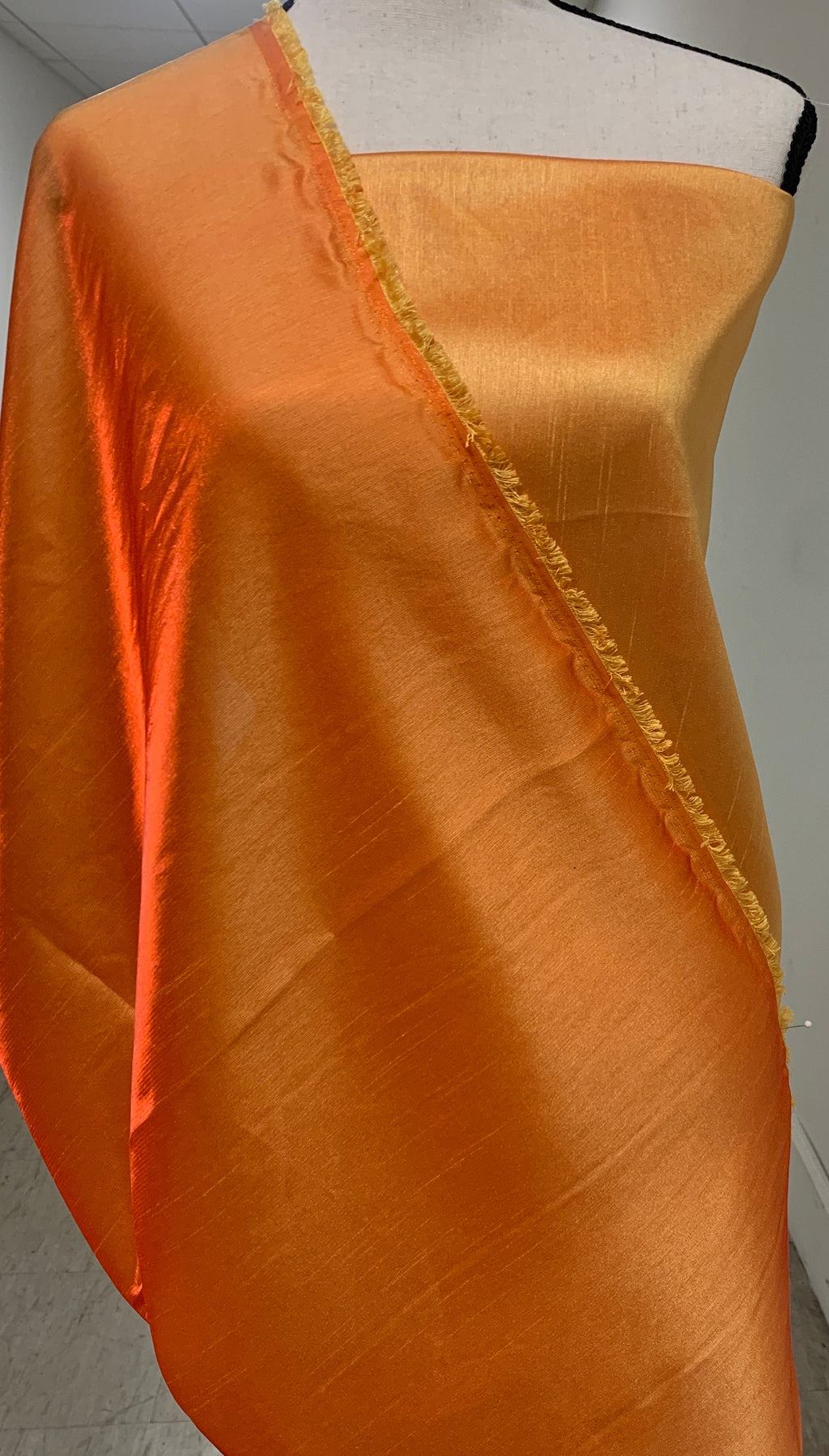 Gold Shimmer fabric two tone threads in yellow and orange, creating an orange sheen. Requires dry cleaning for maintenance. Free sample.