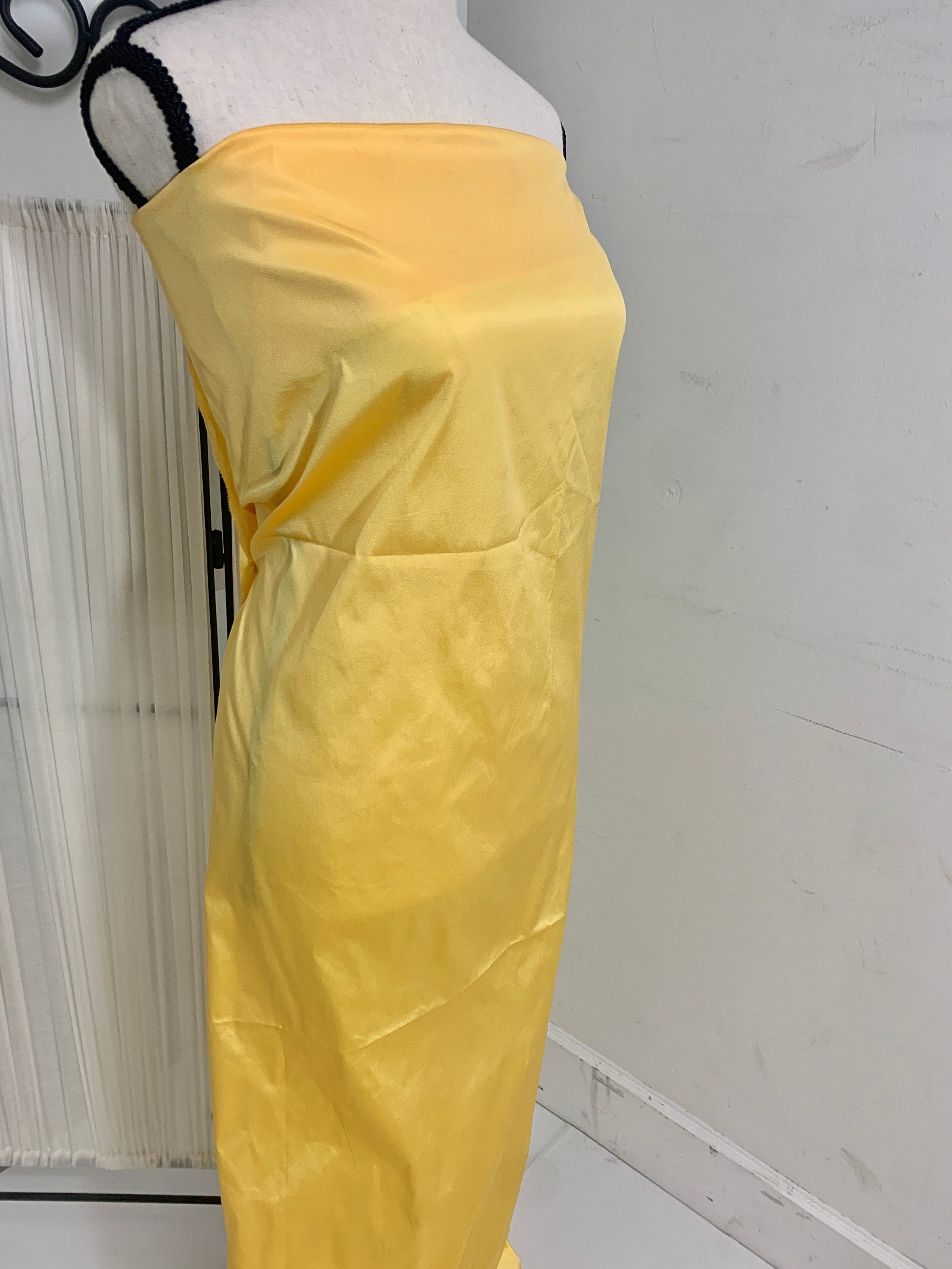Yellow Taffeta Two tone fabric width 58" polyester actual color is yellow with gold tone great for party dress.