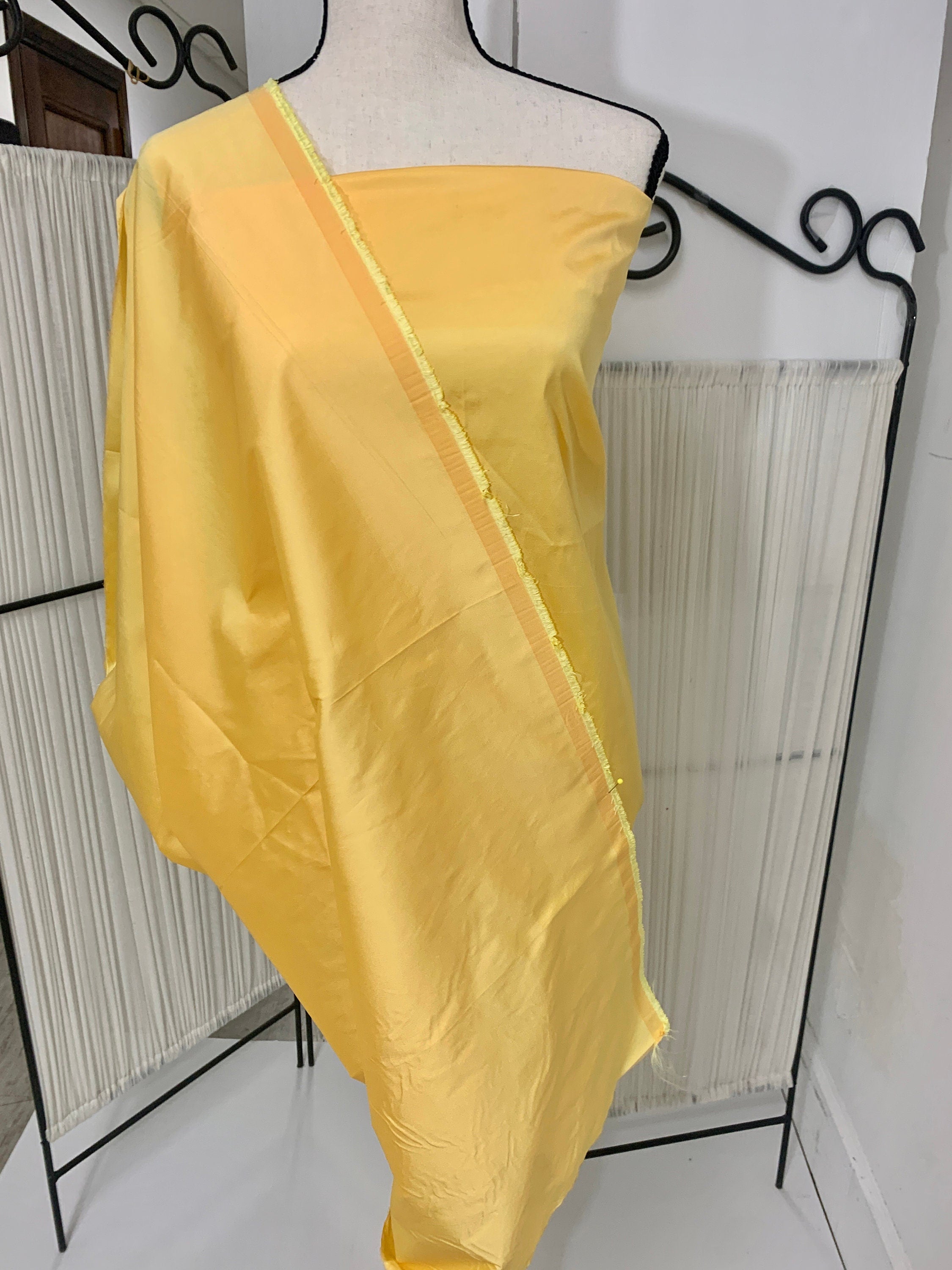 Yellow Taffeta Two tone fabric width 58" polyester actual color is yellow with gold tone great for party dress.
