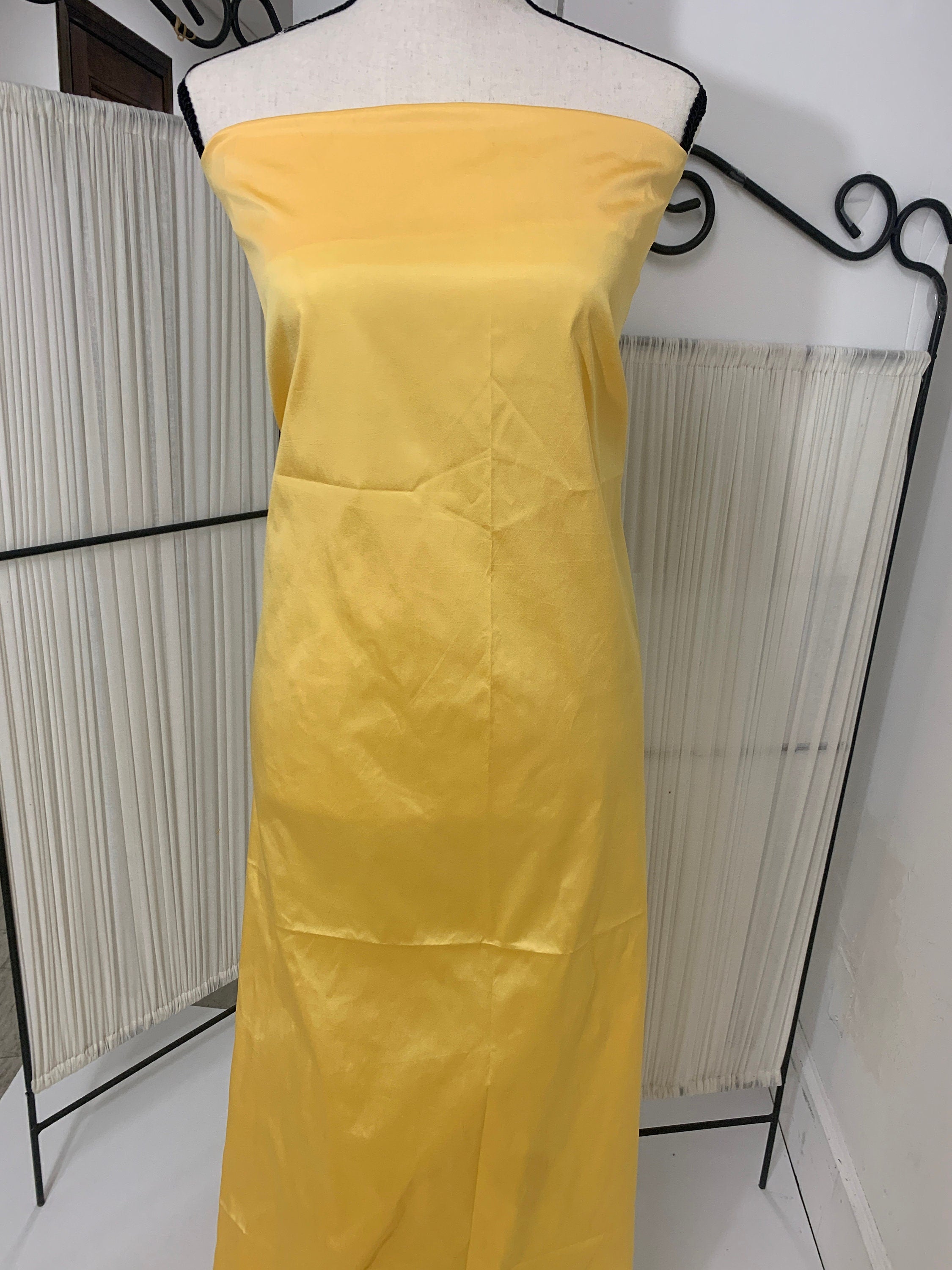 Yellow Taffeta Two tone fabric width 58" polyester actual color is yellow with gold tone great for party dress.