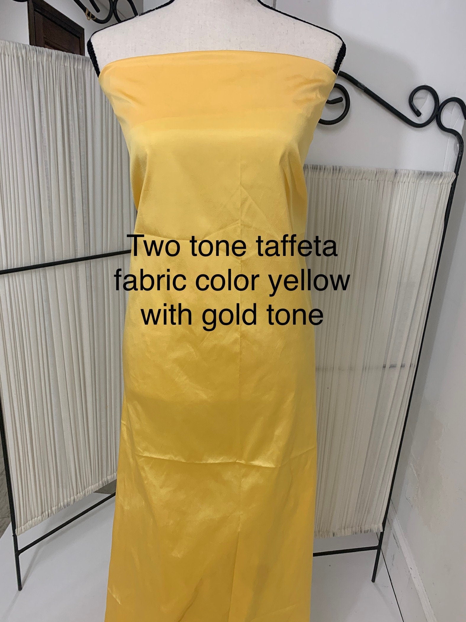 Yellow Taffeta Two tone fabric width 58" polyester actual color is yellow with gold tone great for party dress.