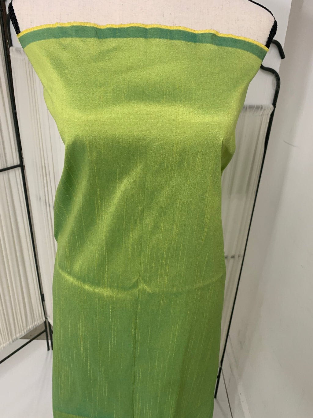 Olive poly dupioni fabric width 58". fabric has fuchsia tone, made of two different color of olive and turquoise blue. free smple.