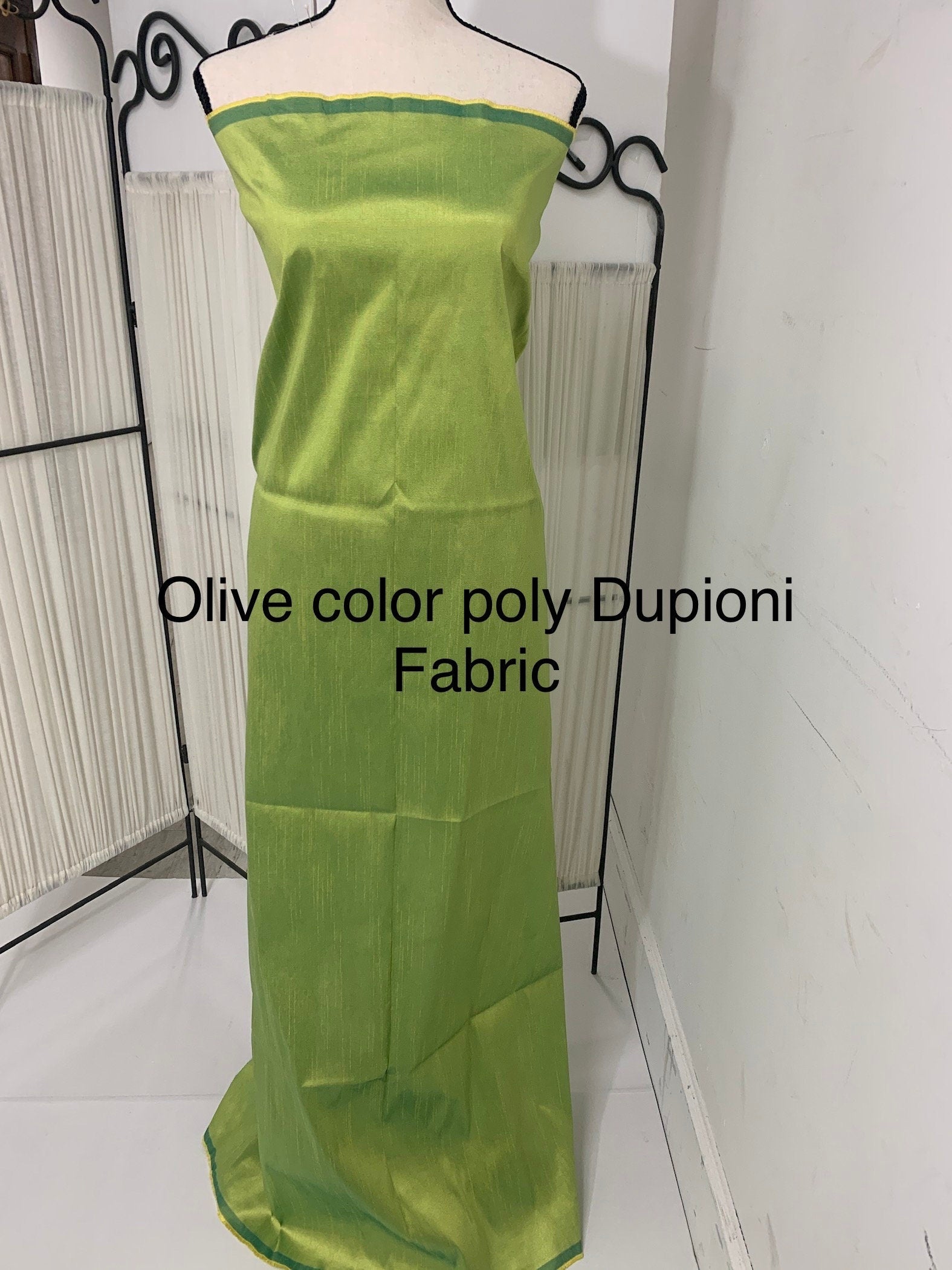 Olive poly dupioni fabric width 58". fabric has fuchsia tone, made of two different color of olive and turquoise blue. free smple.