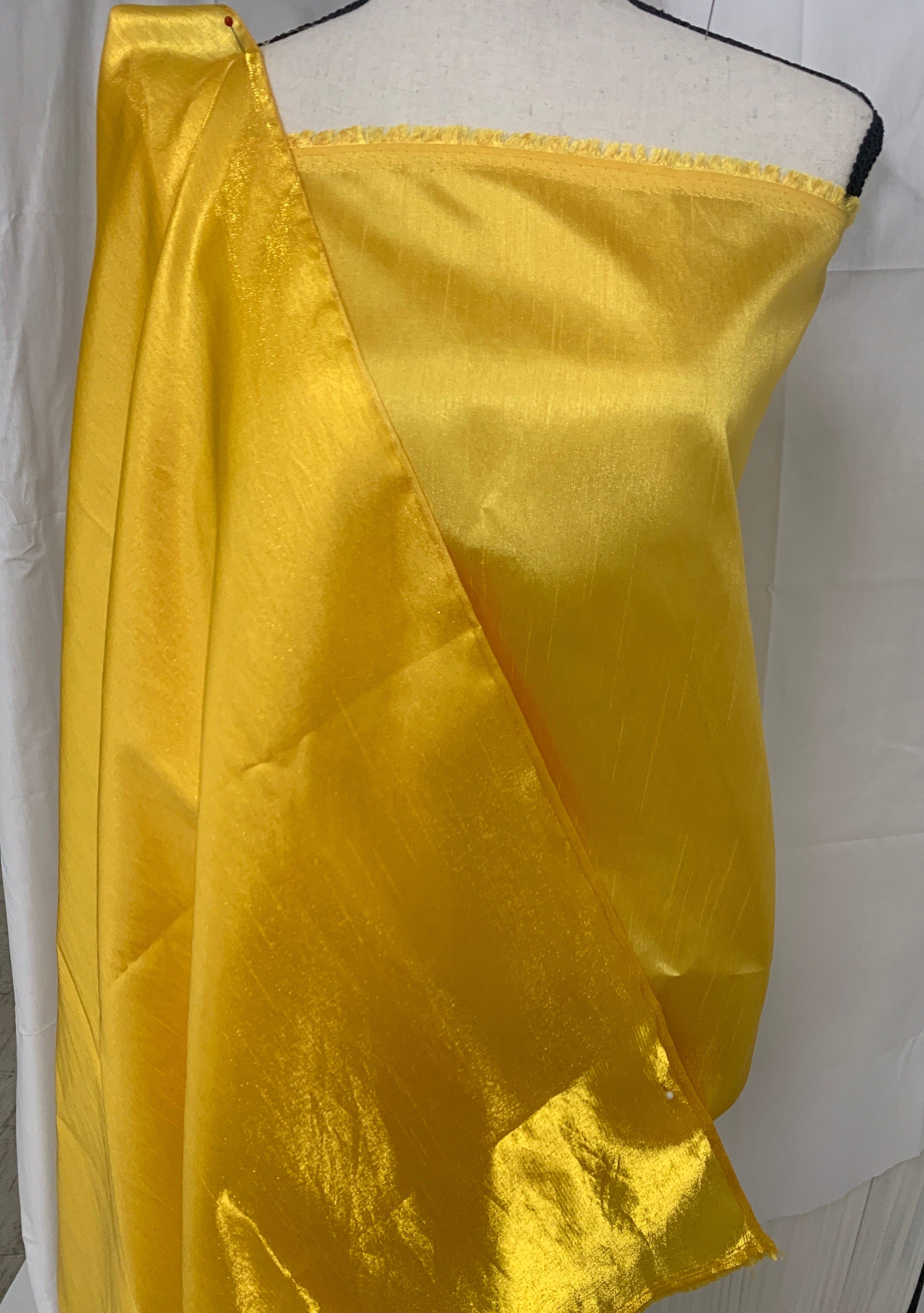 Yellow shimmer shantung fabric, width 58". Is a double sided fabric with slub, shimmery and dull sides dry clean fabric. Free sample.