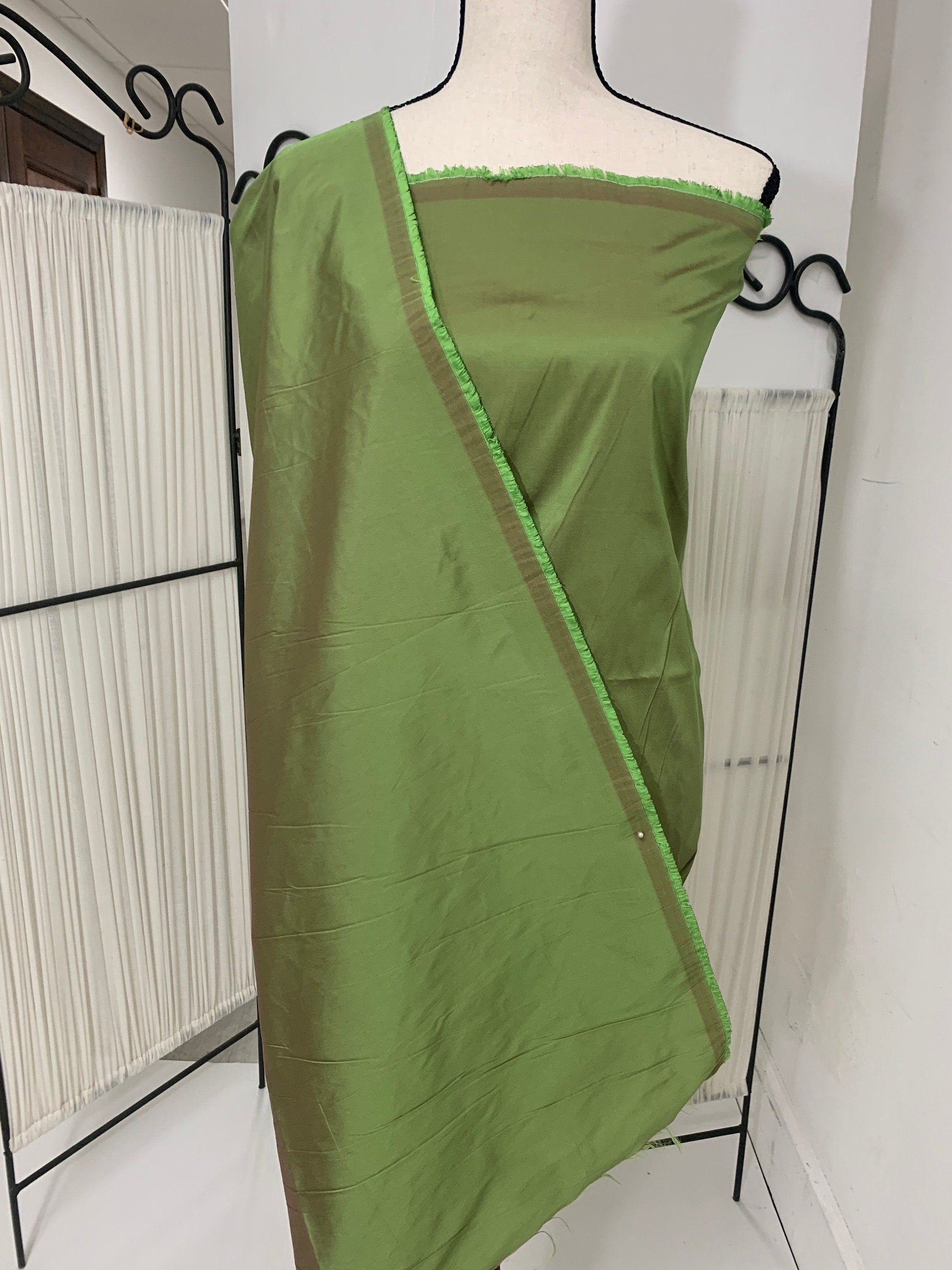 A 2 yards cut Olive Taffeta fabric . Two tone fabric width 58" polyester fabric has a tone of Fuchsia shading. FREE sample. item 115
