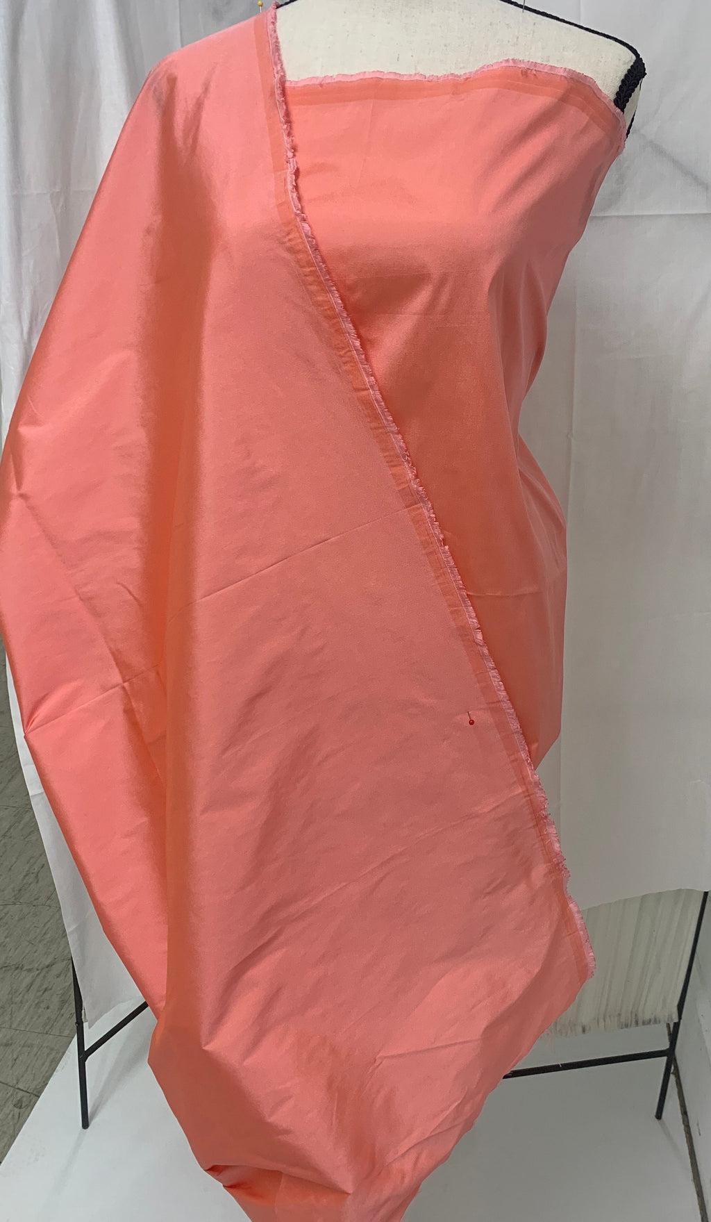 Lt. coral Taffeta fabric . Two tone fabric width 58" polyester, has a slight tone of orange and pink shading. free sample. item 113