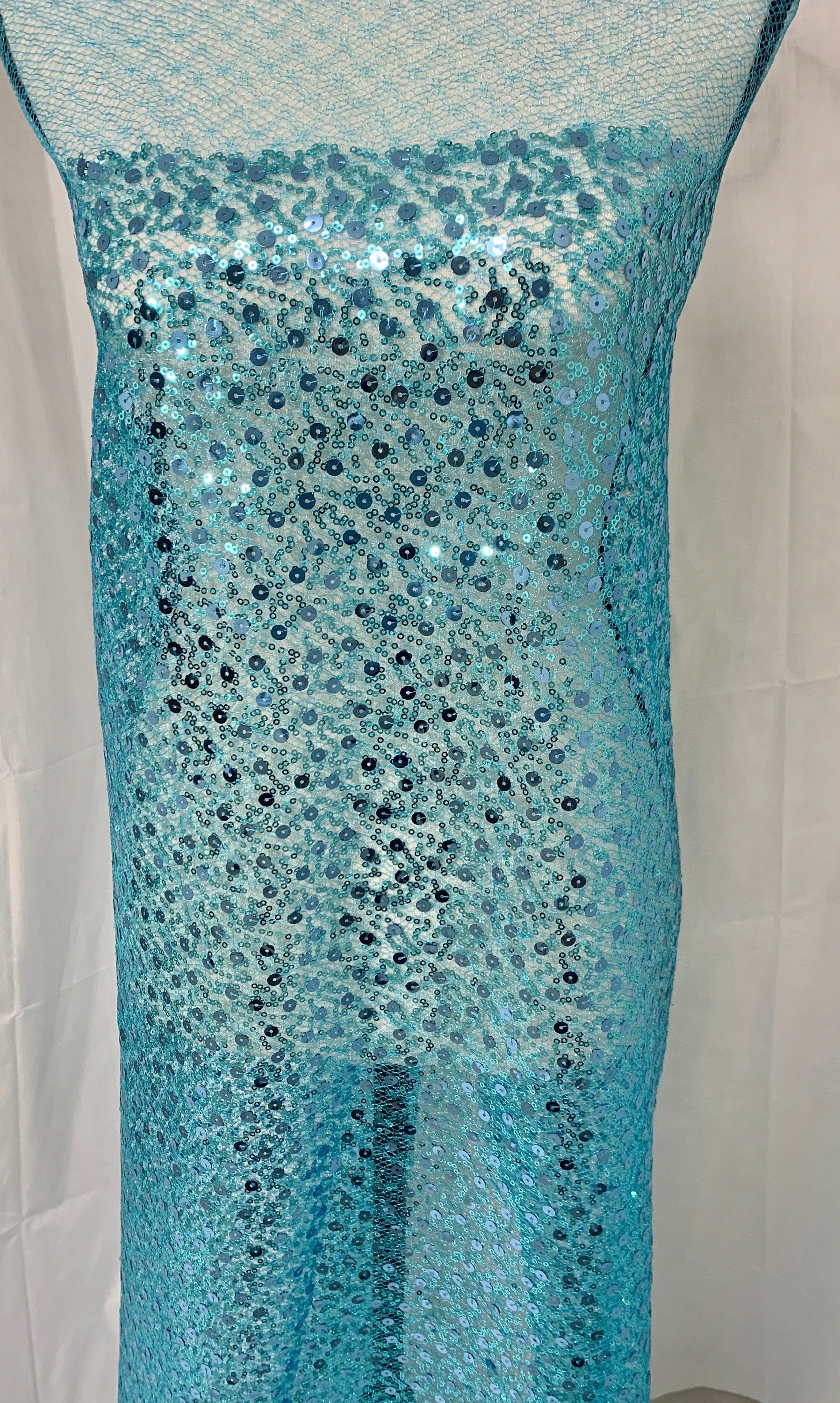 Turquoise Sequence mesh fabric, width 58", sell by yard, 3" plain mesh salvage on each side. great item for dress, costume, decoration.