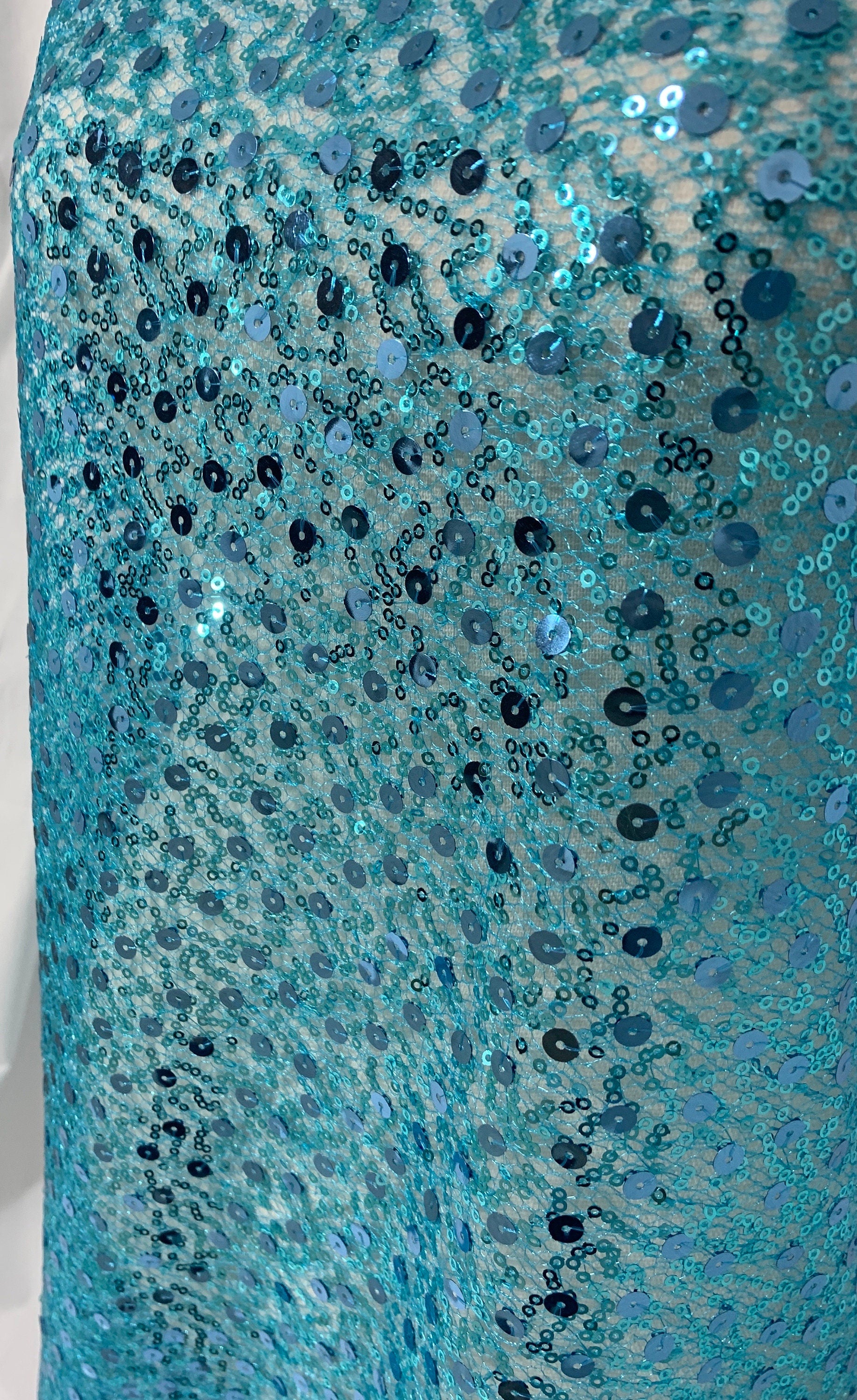 Turquoise Sequence mesh fabric, width 58", sell by yard, 3" plain mesh salvage on each side. great item for dress, costume, decoration.