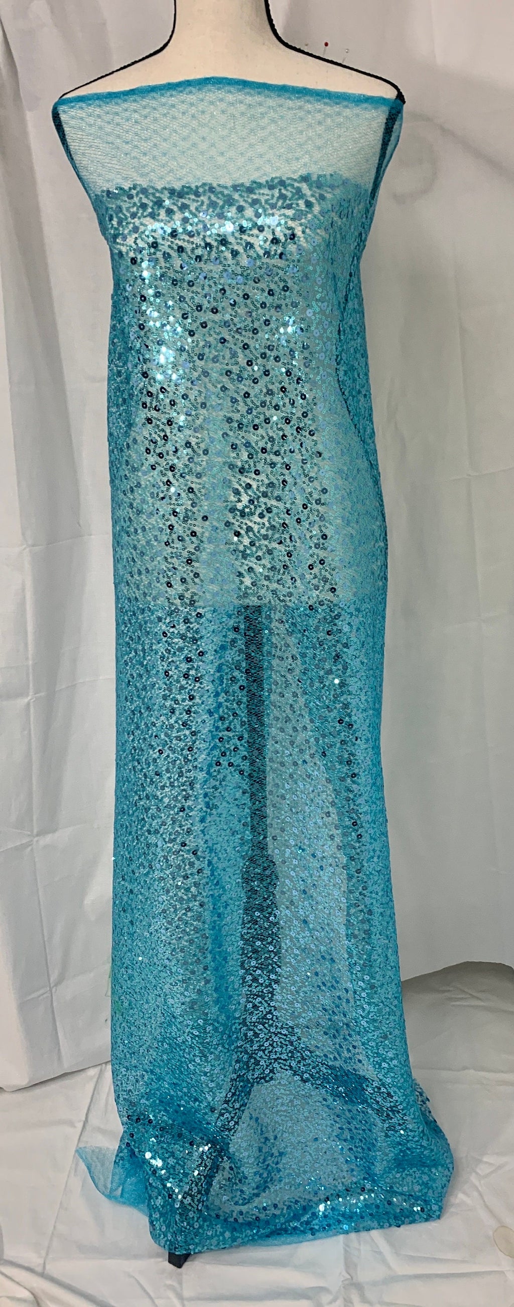 Turquoise Sequence mesh fabric, width 58", sell by yard, 3" plain mesh salvage on each side. great item for dress, costume, decoration.