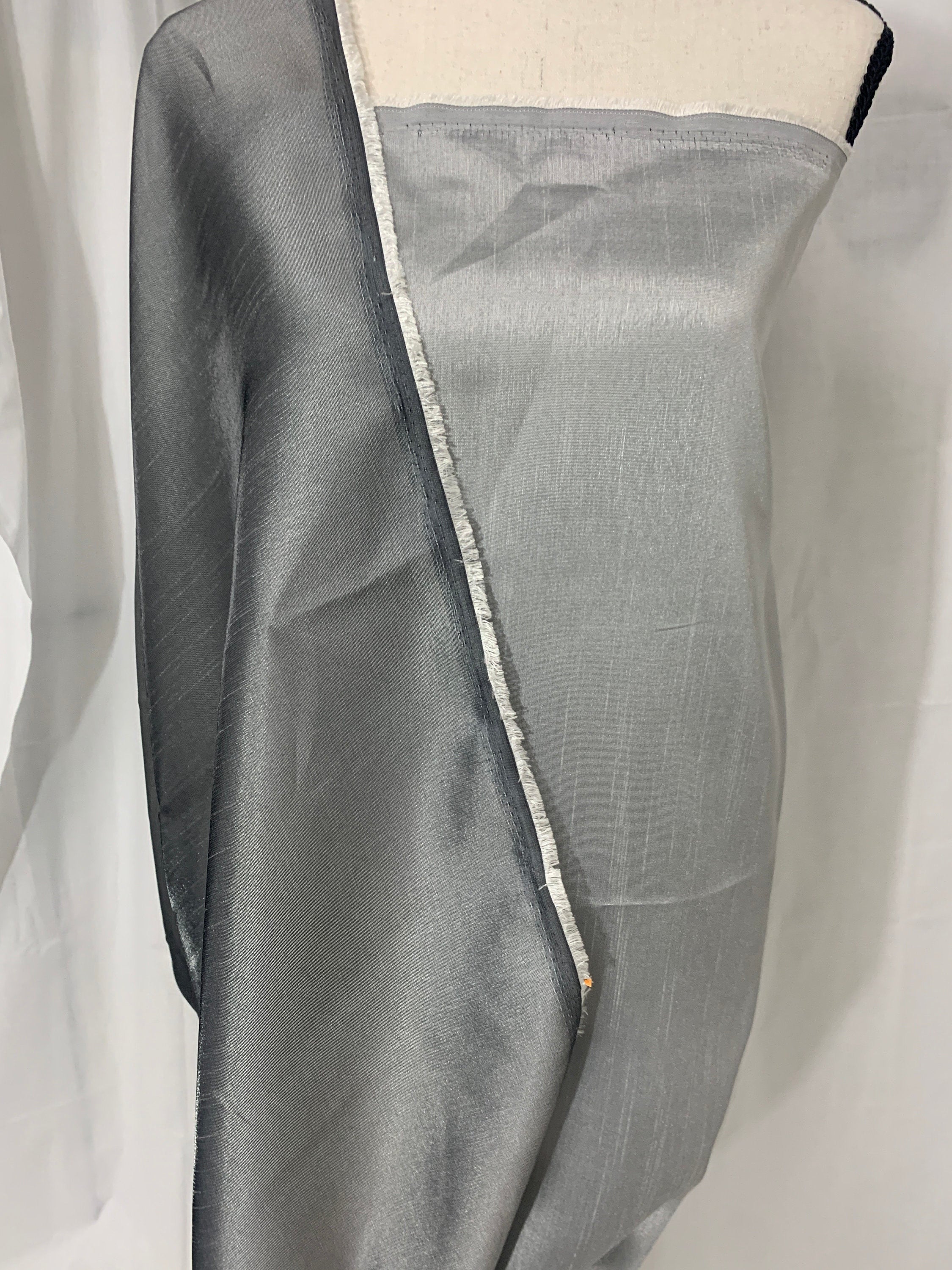 silver grey shimmer shantung fabric, width 58". Is a double sided fabric with slub, shimmery and dull sides dry clean fabric. Free sample.