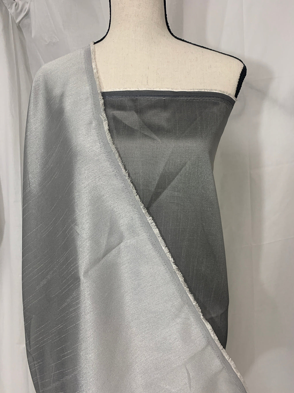silver grey shimmer shantung fabric, width 58". Is a double sided fabric with slub, shimmery and dull sides dry clean fabric. Free sample.