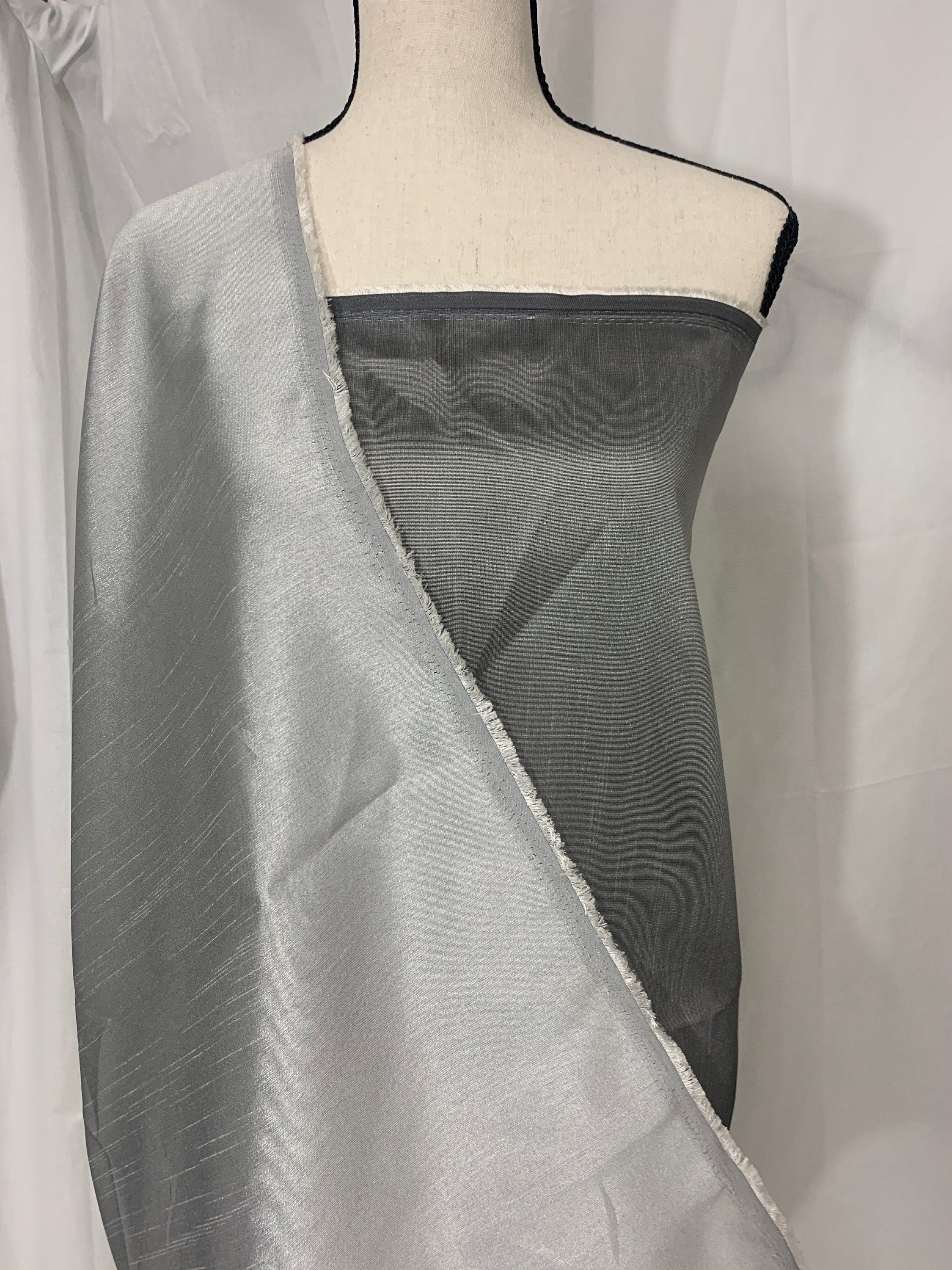 silver grey shimmer shantung fabric, width 58". Is a double sided fabric with slub, shimmery and dull sides dry clean fabric. Free sample.