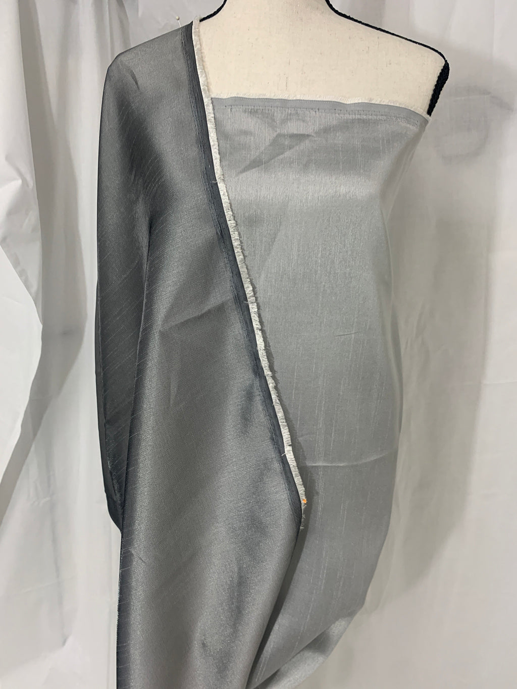 silver grey shimmer shantung fabric, width 58". Is a double sided fabric with slub, shimmery and dull sides dry clean fabric. Free sample.