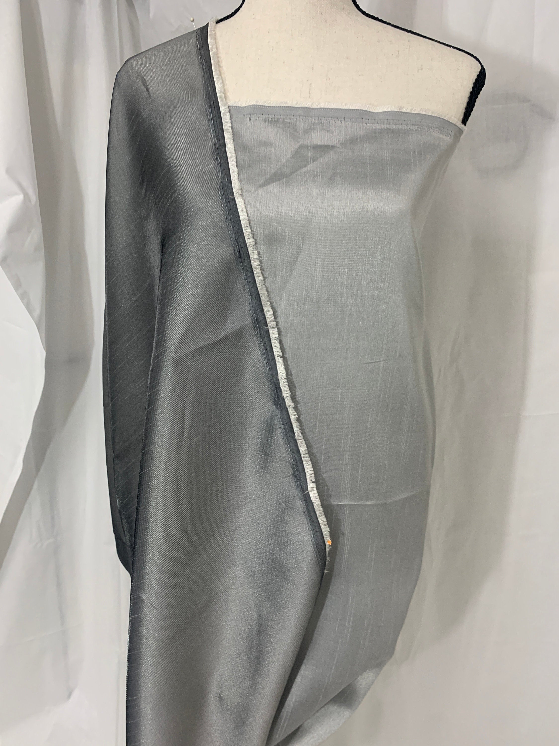 silver grey shimmer shantung fabric, width 58". Is a double sided fabric with slub, shimmery and dull sides dry clean fabric. Free sample.