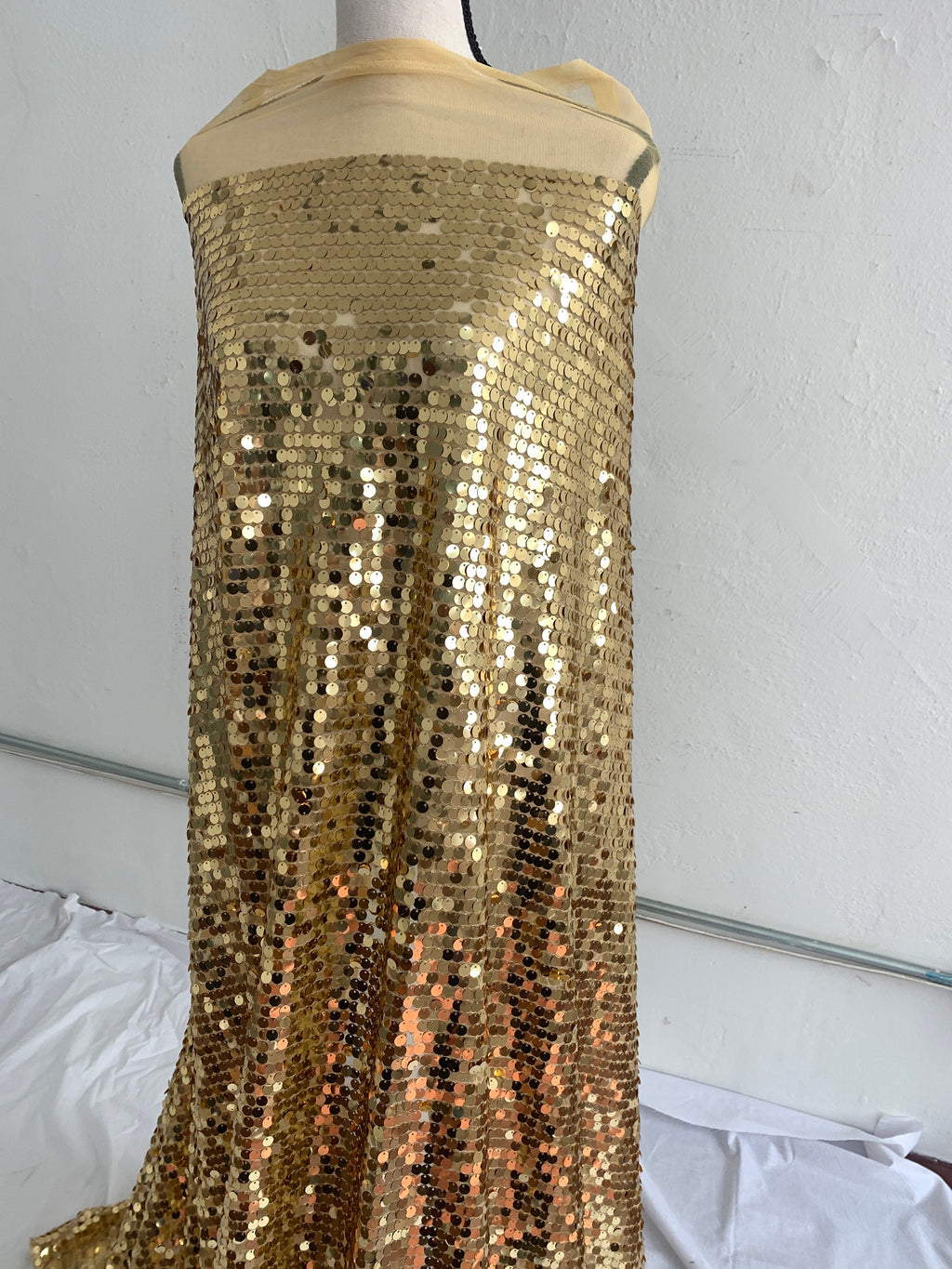 Sequence Gold color 56/60" . fabric has 3" salvage on both sides.