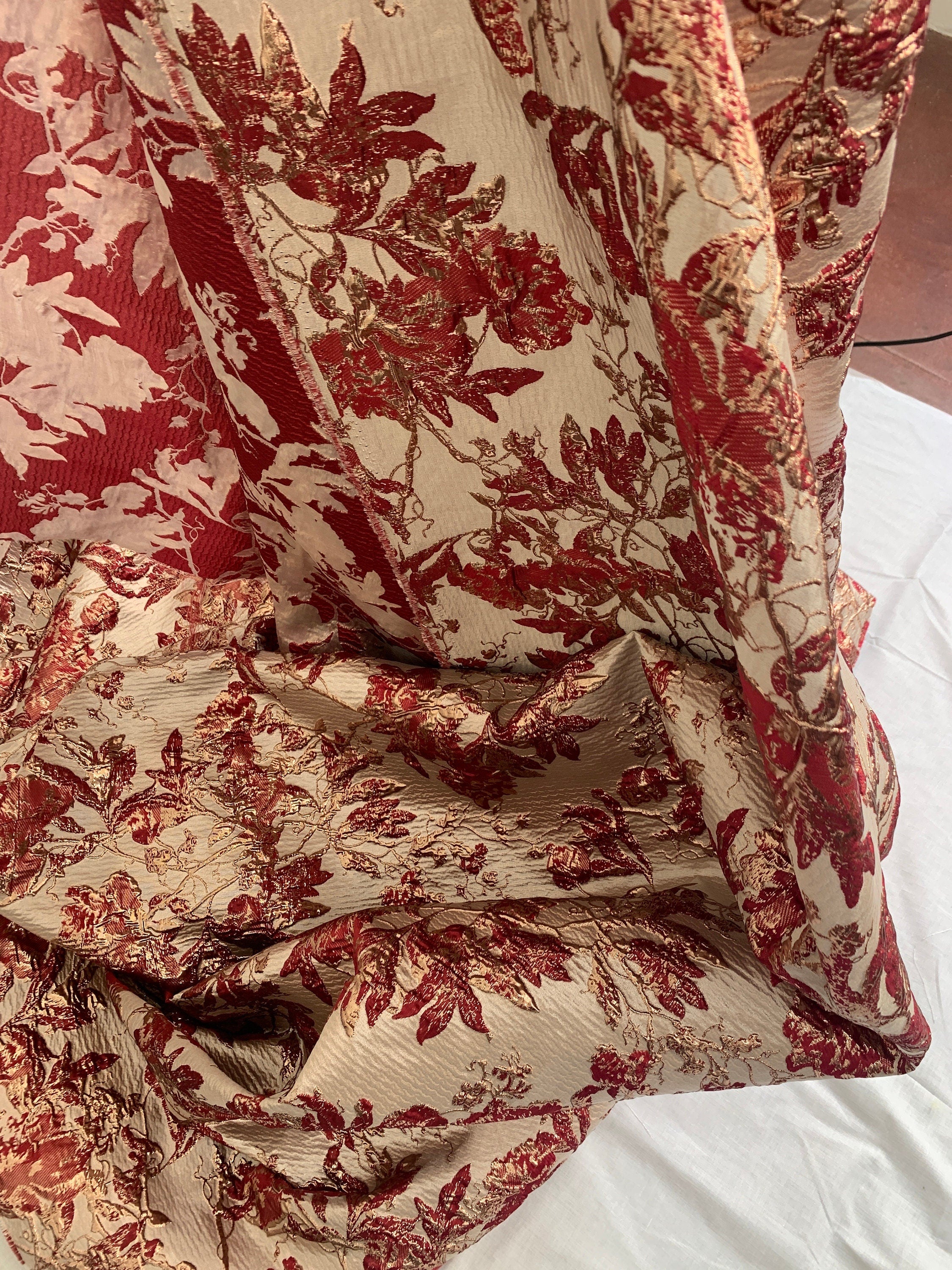 Brocade floral metallic fabric. color burgundy 56"