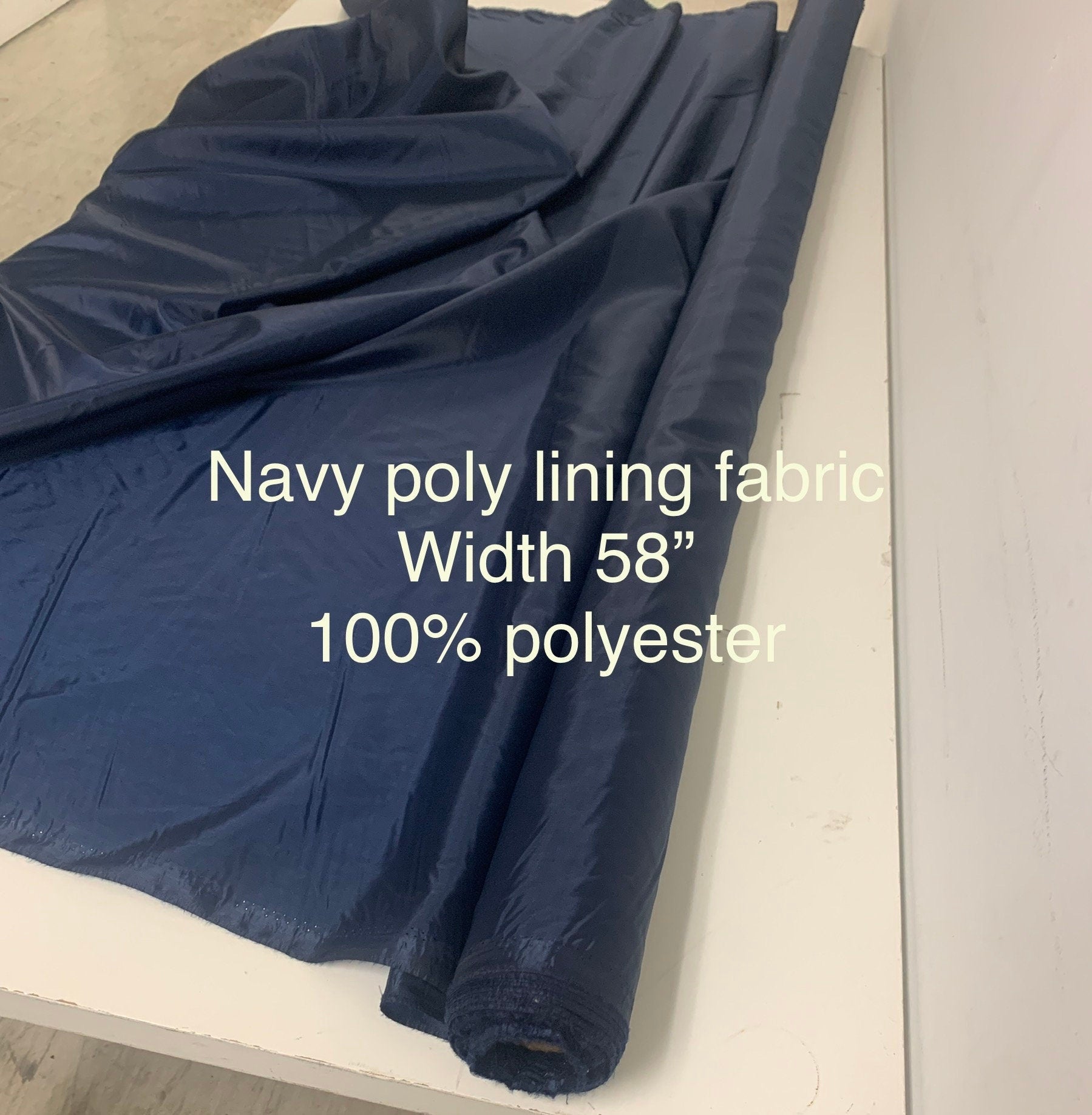 A 2 yards cut Lining fabric color navy, polyester, width 59", sell by 2 yards continuous.