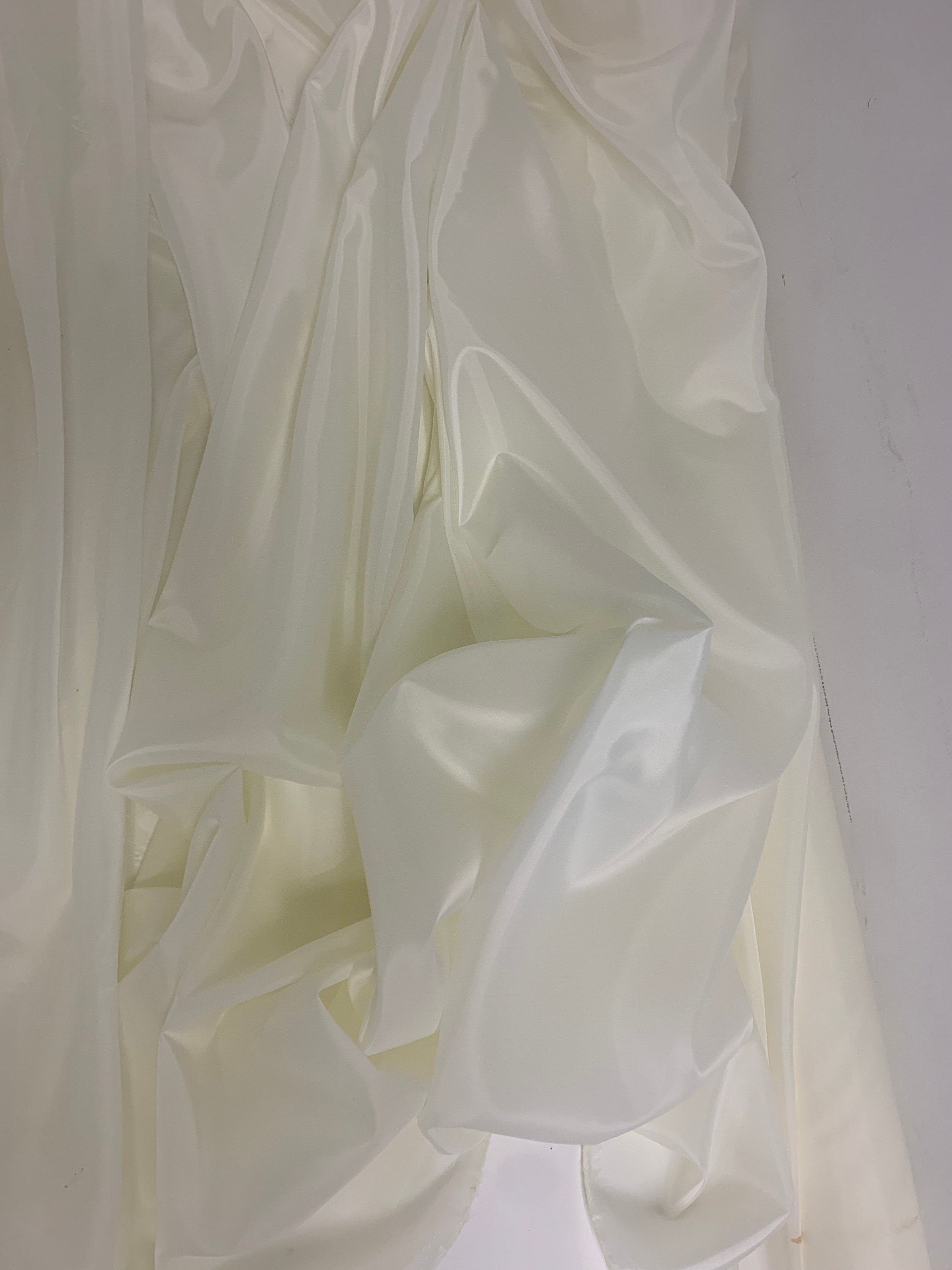 A 2 yards cut Ivory poly Lining fabric, 100% polyester, width 59". sells by 2 yard increment continuous