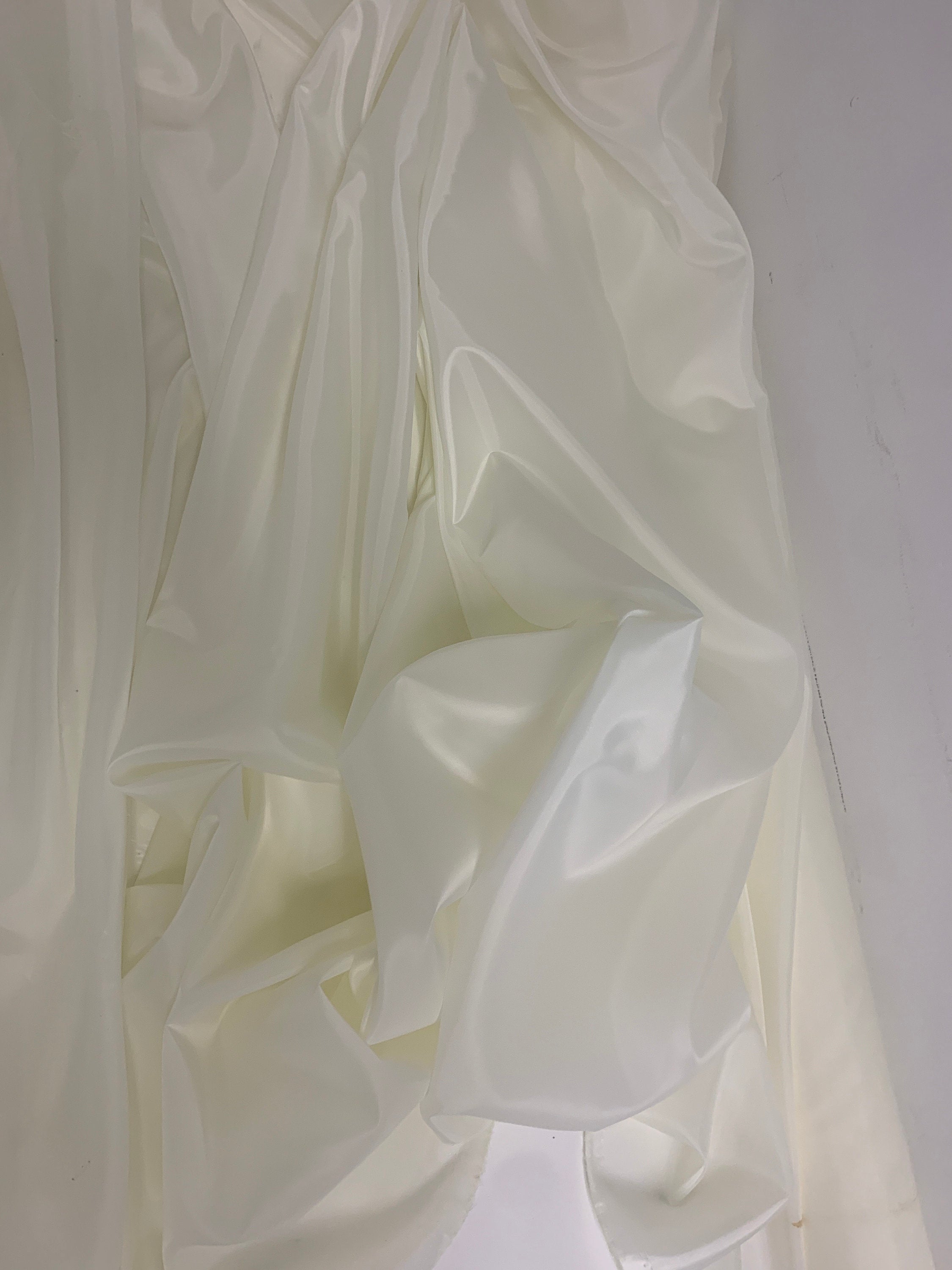 A 2 yards cut Ivory poly Lining fabric, 100% polyester, width 59". sells by 2 yard increment continuous