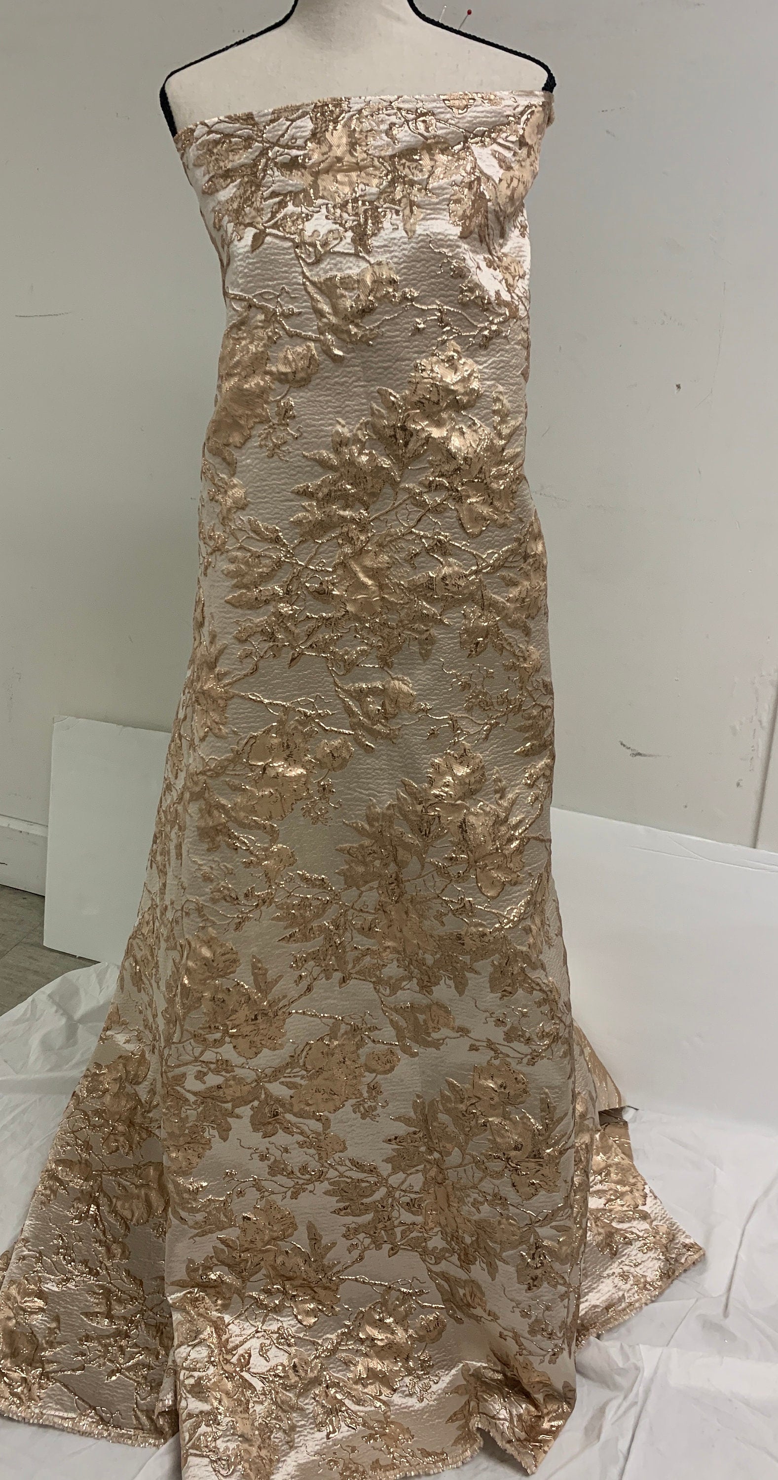 A 5 yards floral metallic Brocade fabric. color is Gold Rose width 56".