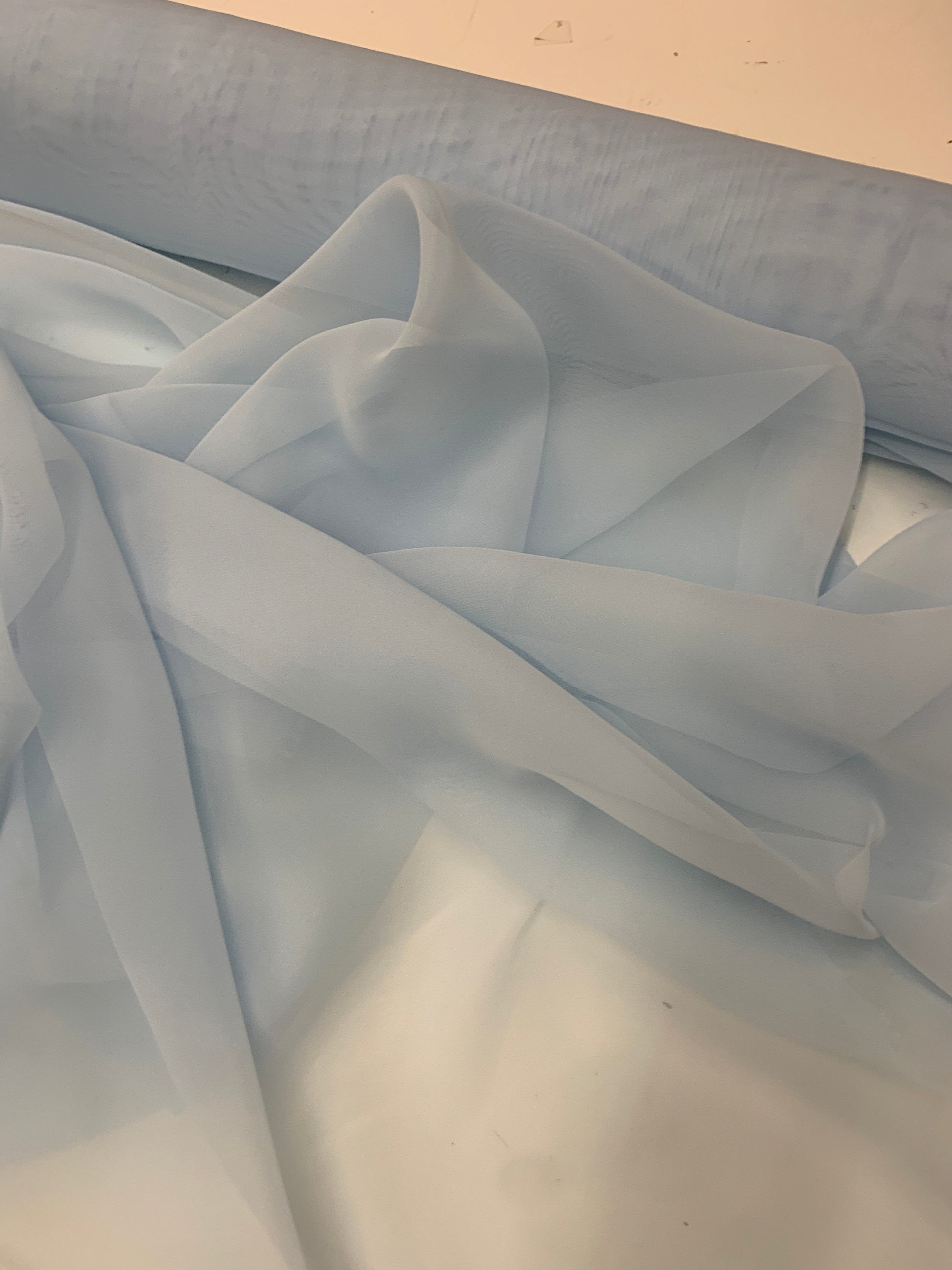 Lt. blue chiffon Fabric width 58/60 inches wide, sell and yards. Free sample Available for domestic address