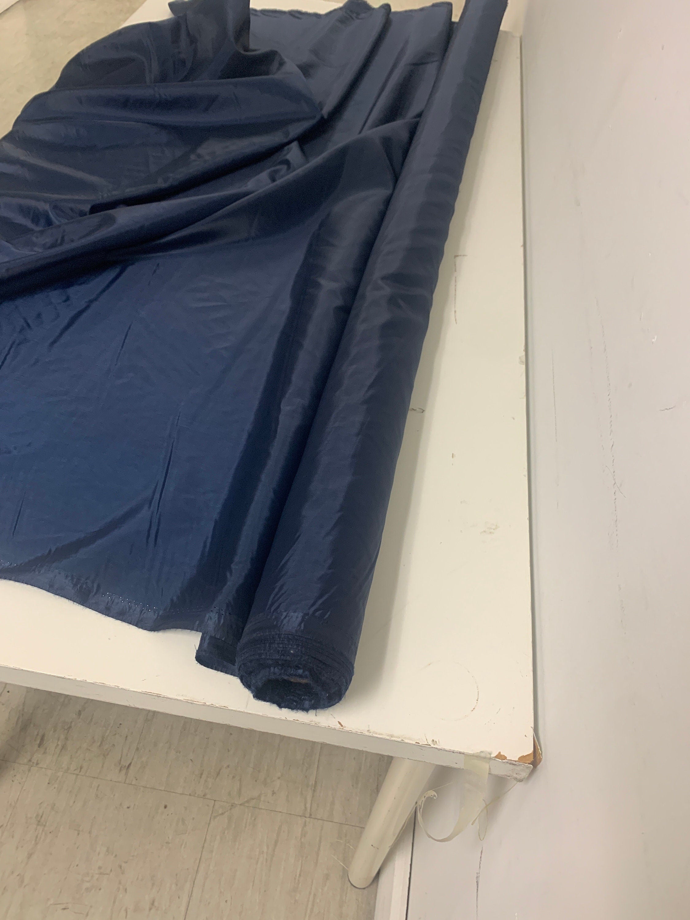A 2 yards cut Lining fabric color navy, polyester, width 59", sell by 2 yards continuous.