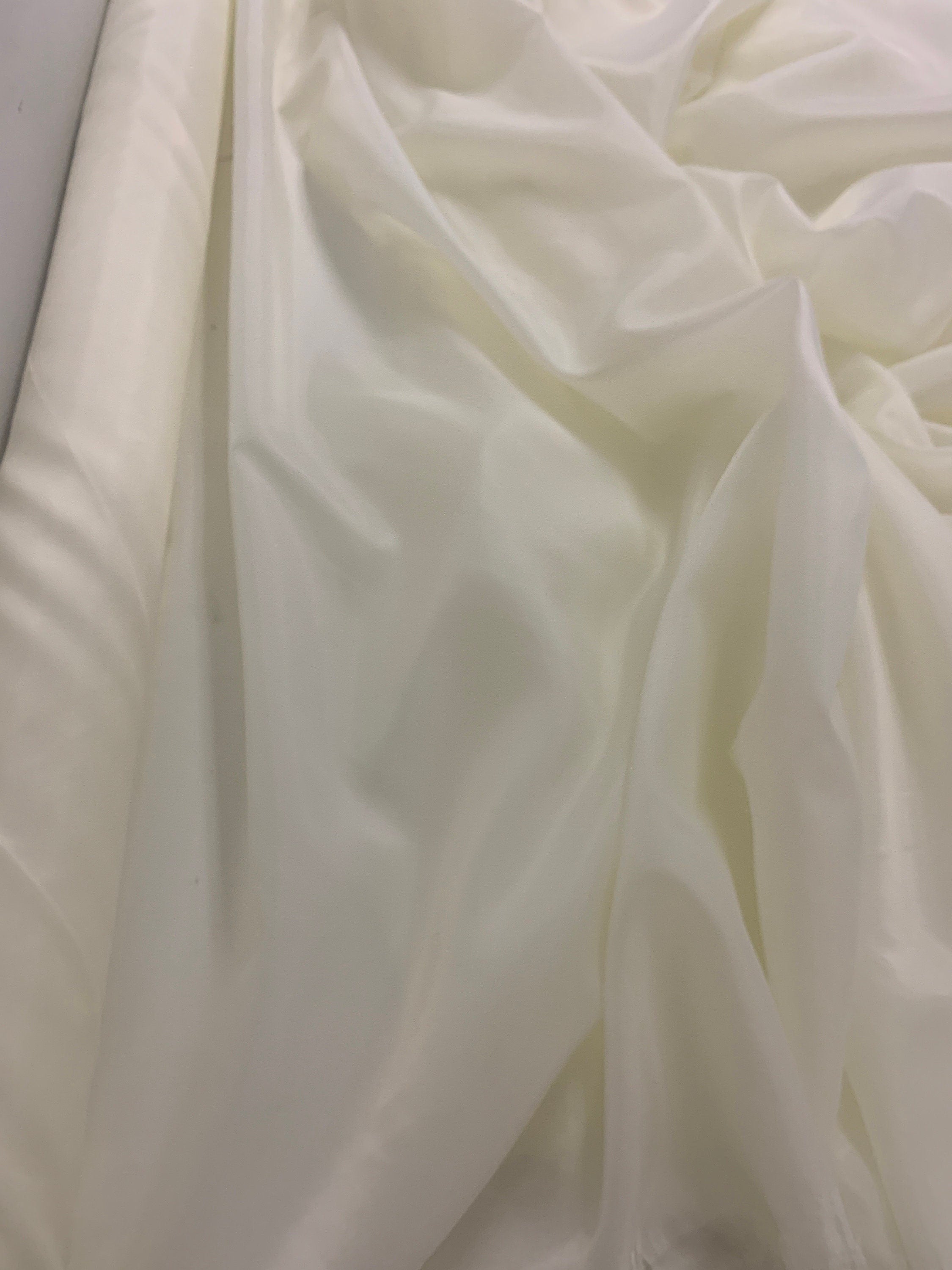 A 2 yards cut Ivory poly Lining fabric, 100% polyester, width 59". sells by 2 yard increment continuous