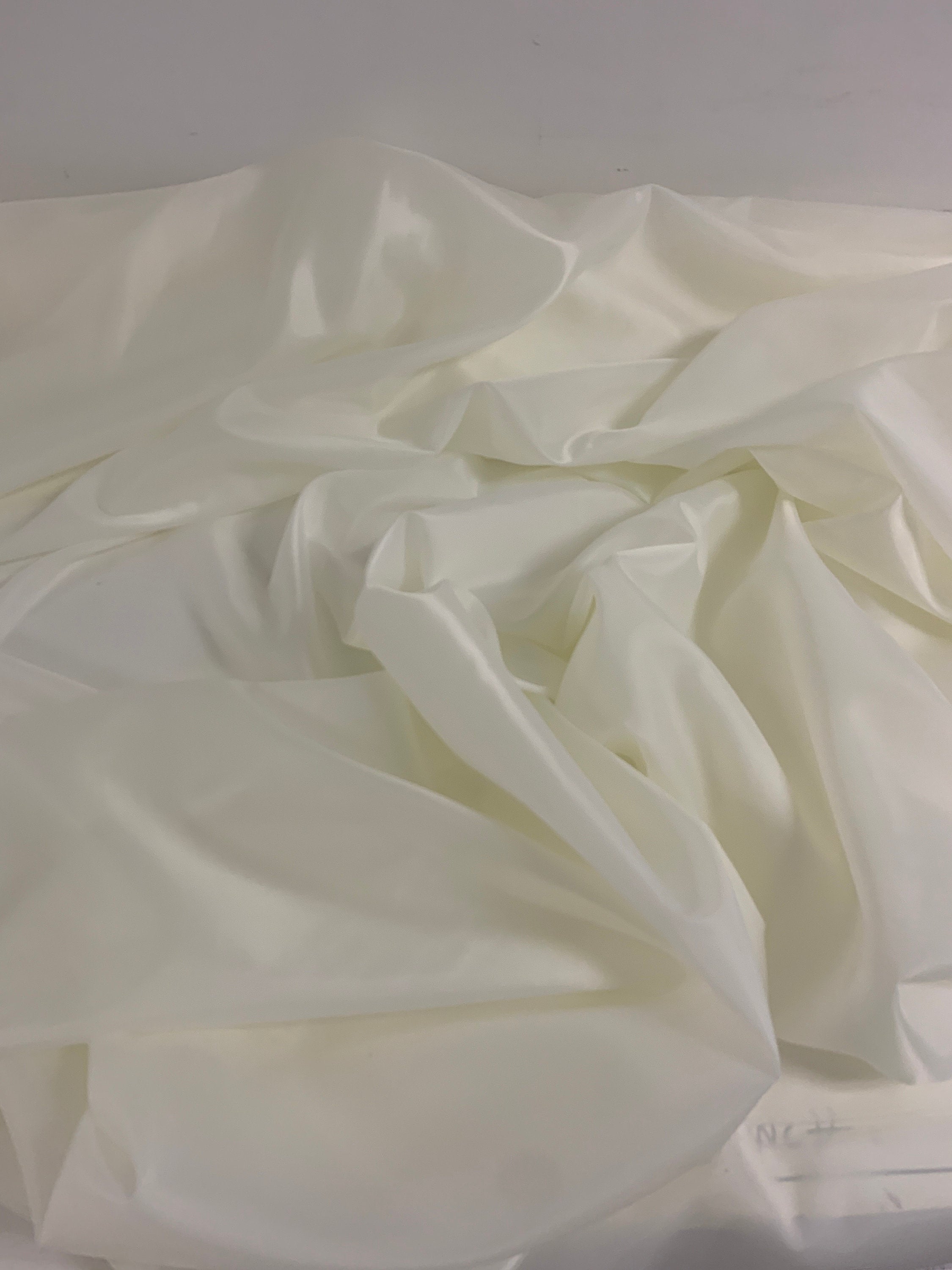 A 2 yards cut Ivory poly Lining fabric, 100% polyester, width 59". sells by 2 yard increment continuous