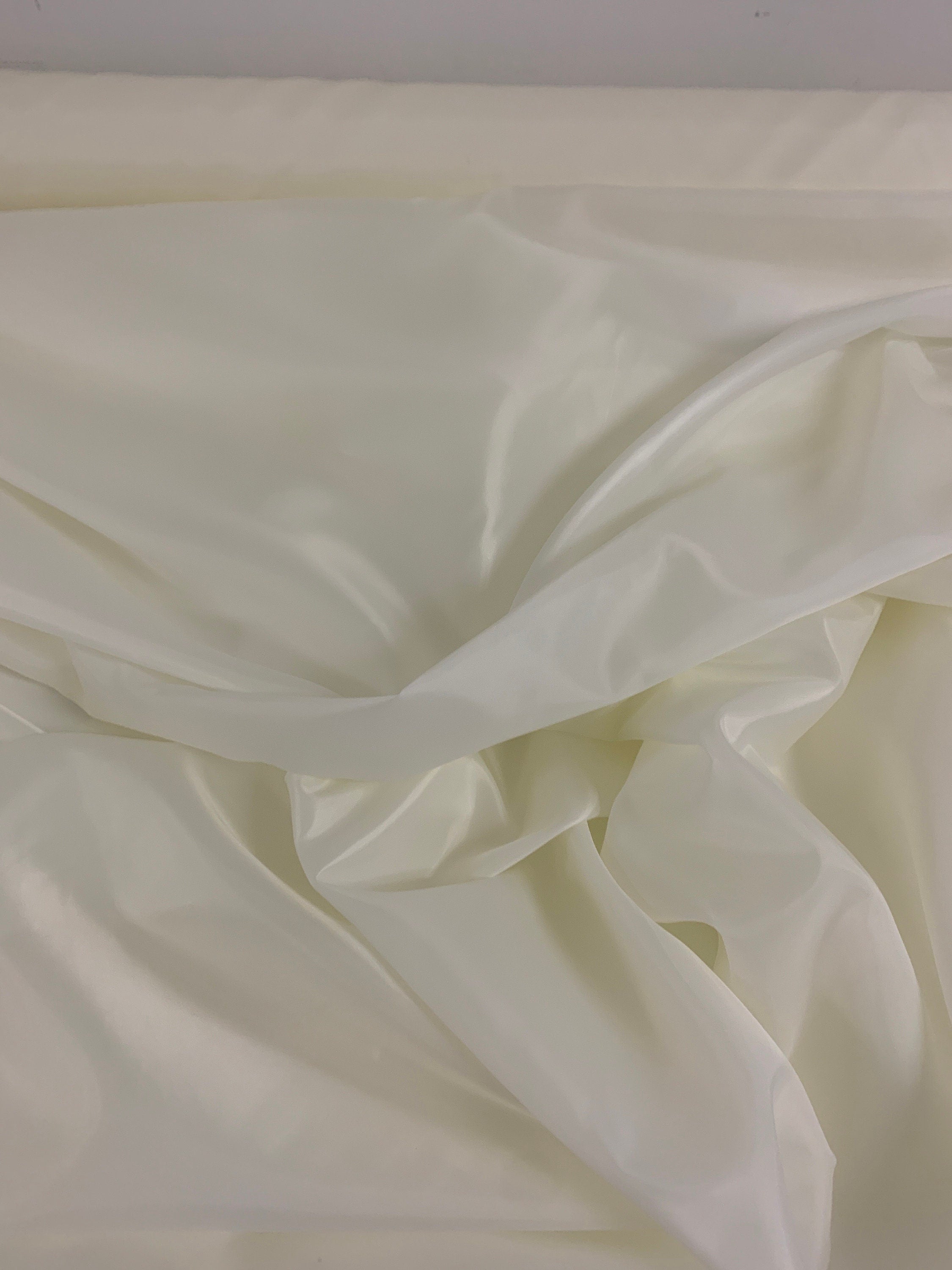 A 2 yards cut Ivory poly Lining fabric, 100% polyester, width 59". sells by 2 yard increment continuous