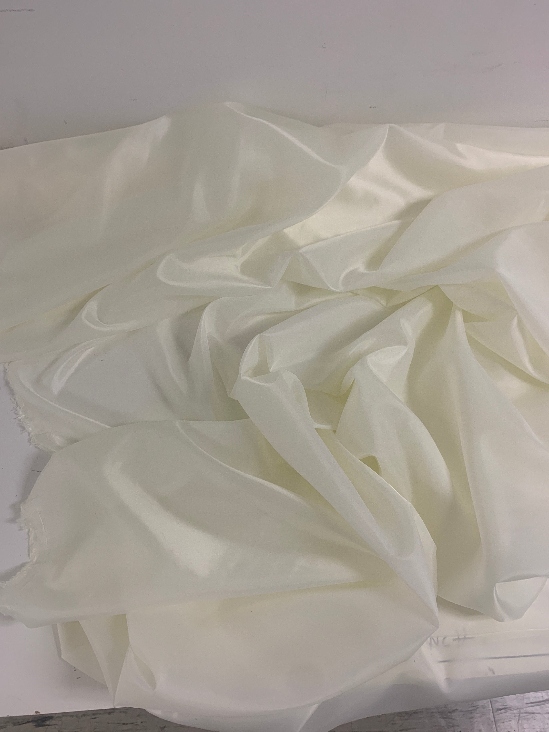 A 2 yards cut Ivory poly Lining fabric, 100% polyester, width 59". sells by 2 yard increment continuous