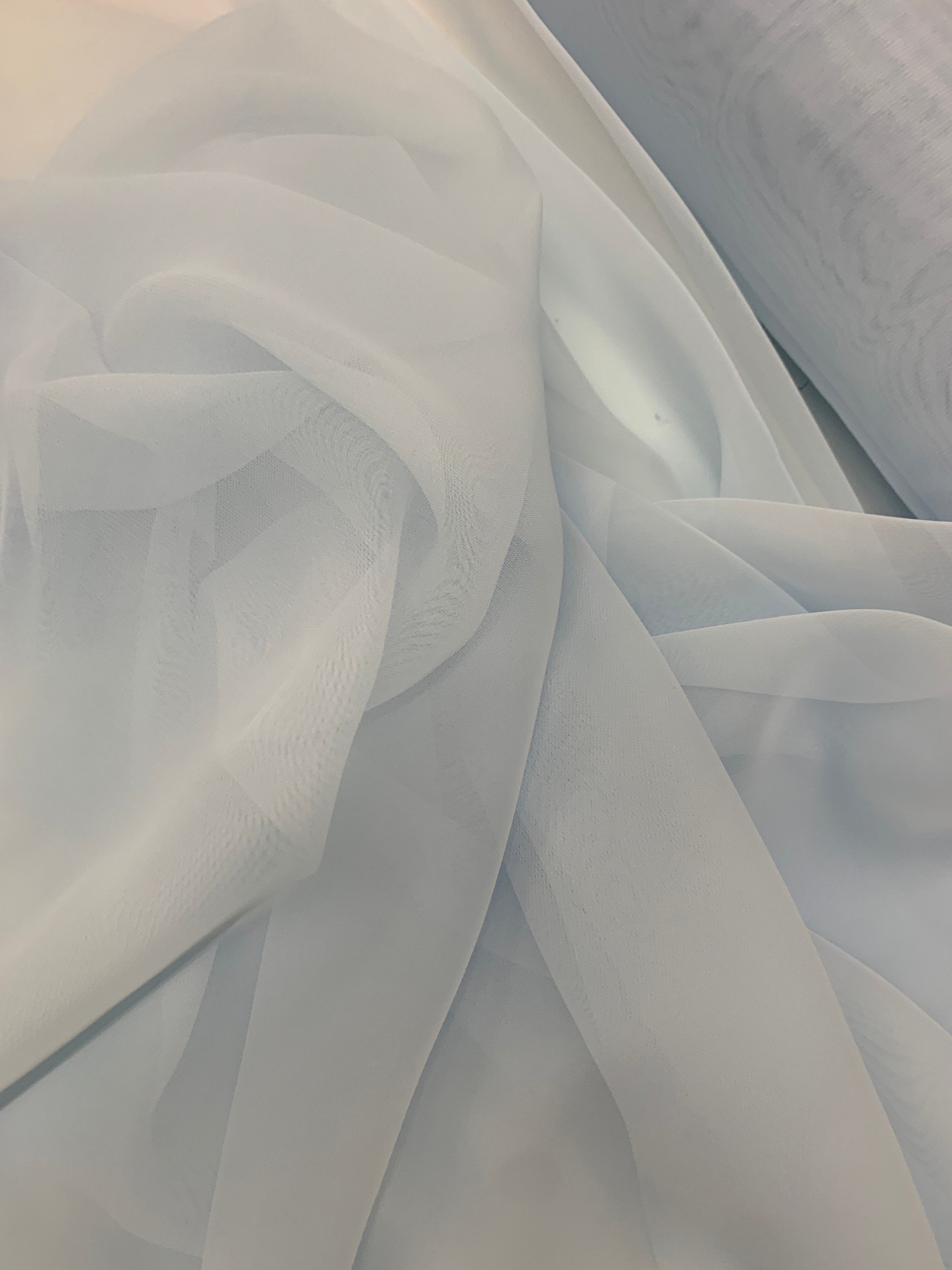 Lt. blue chiffon Fabric width 58/60 inches wide, sell and yards. Free sample Available for domestic address