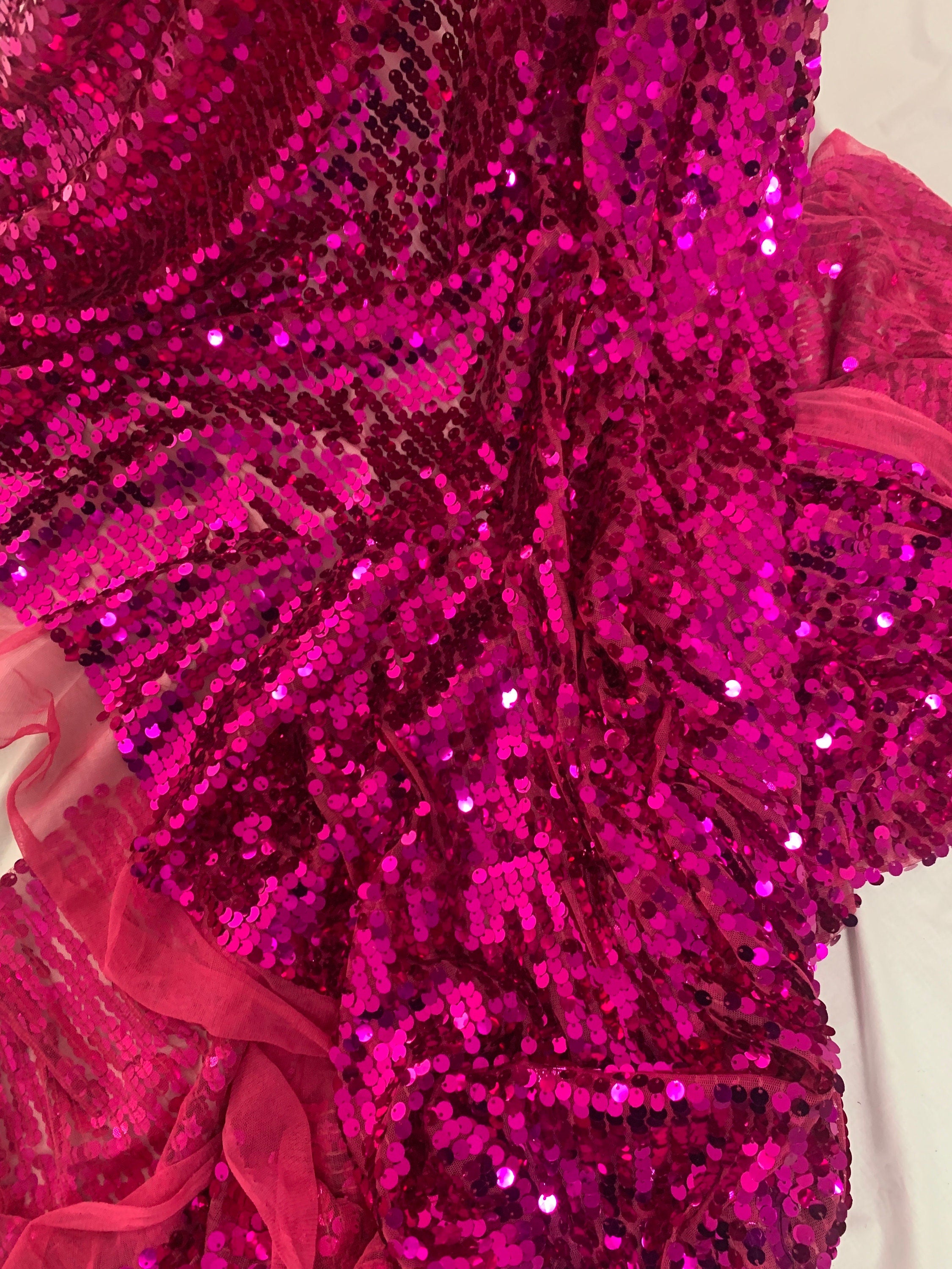 5 yards cut Fucshia sequence fabric.
