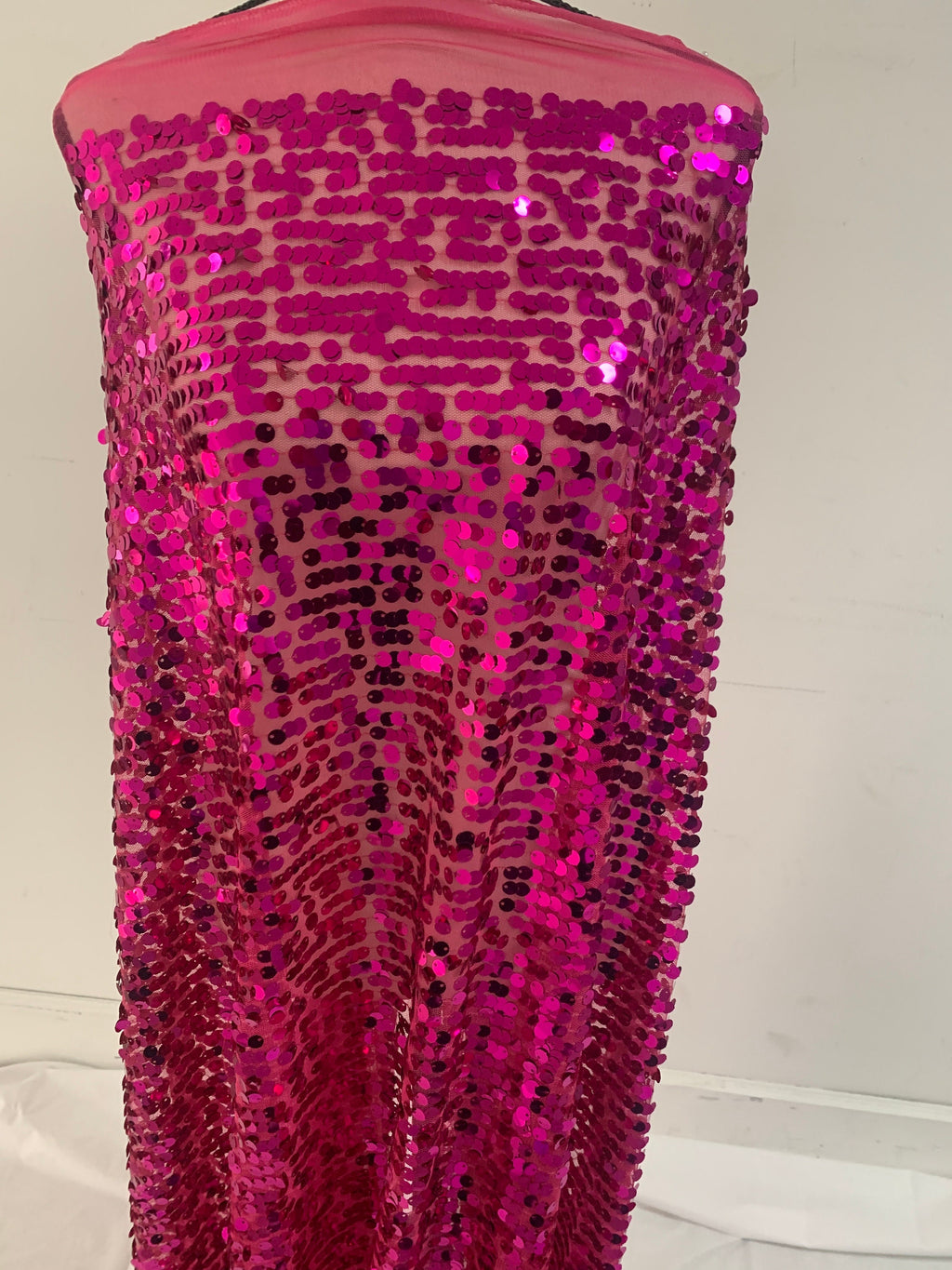 5 yards cut Fucshia sequence fabric.